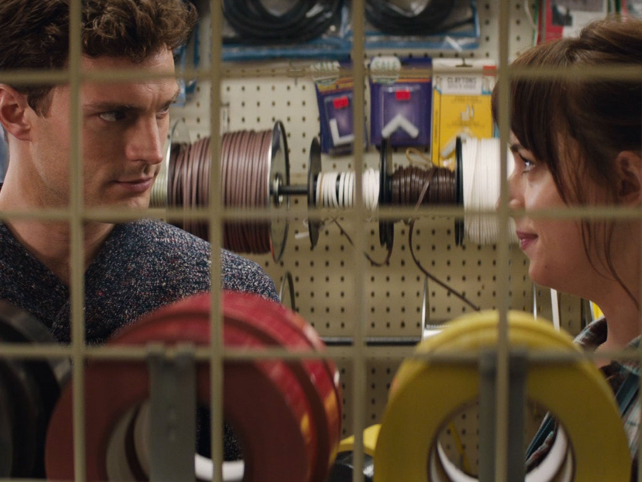 Jamie Dornan and Dakota Johnson as Christian Grey and Anastasia Steele in Fifty Shades of Grey