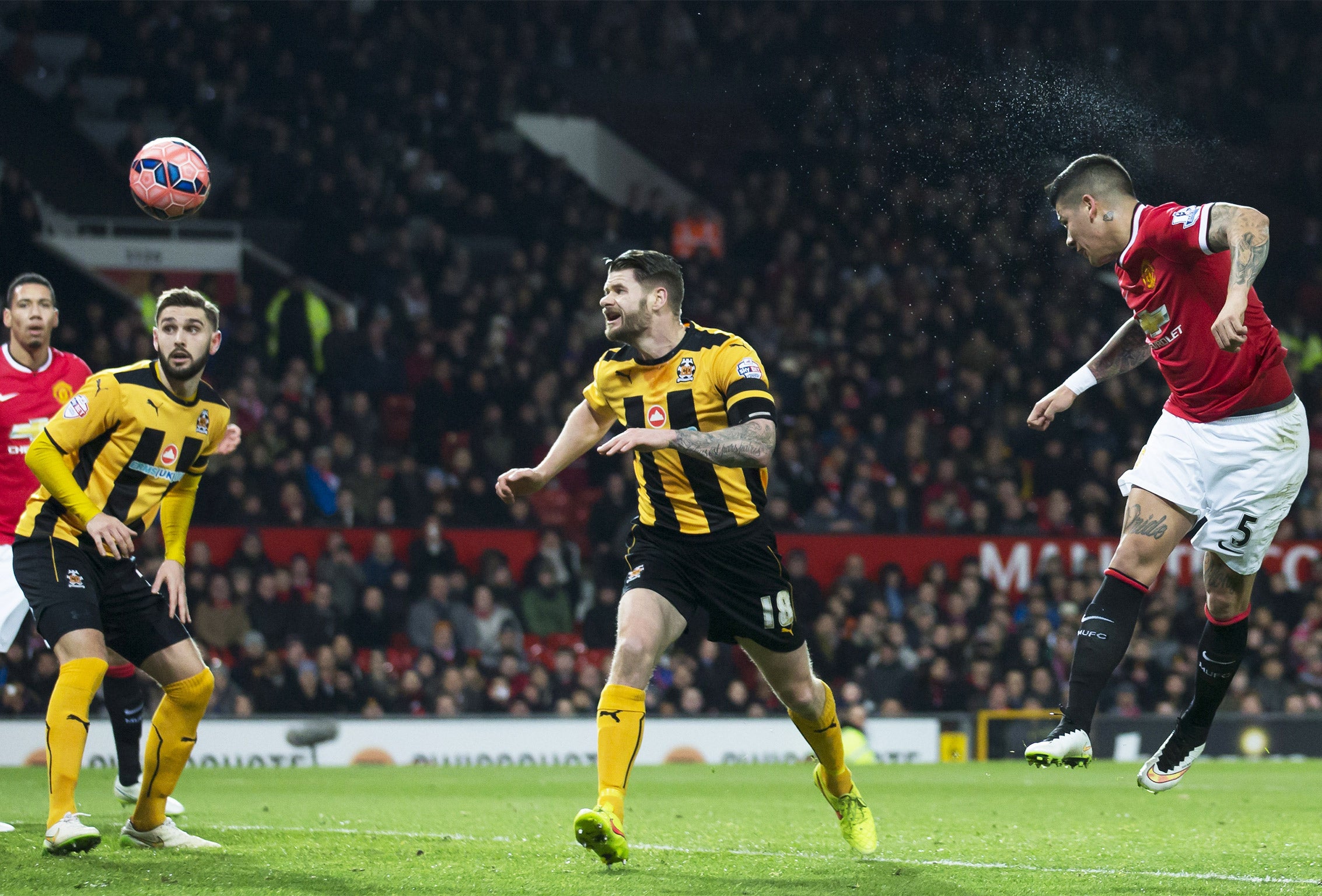 Marcos Rojo powers a header towards goal for Manchester United's second