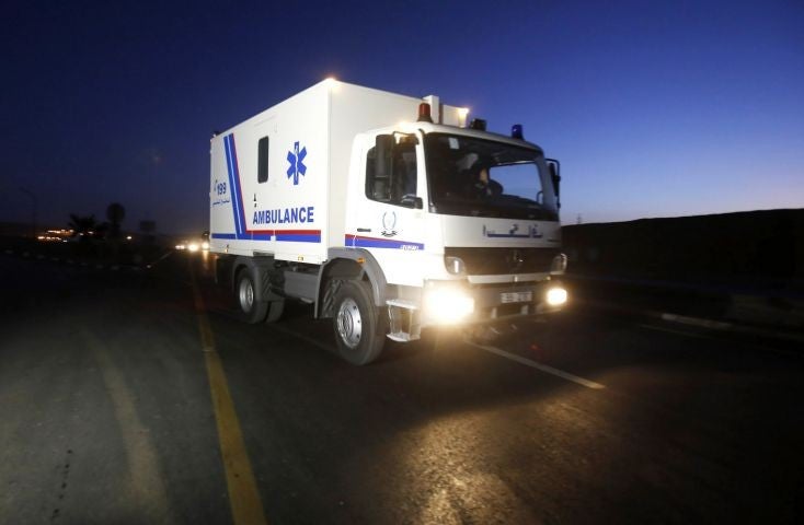 An ambulance transports the bodies of Sajida al-Rishawi and Ziad al-Karbouly, two Iraqis linked to al-Qaida, after their executions at Swaqa prison