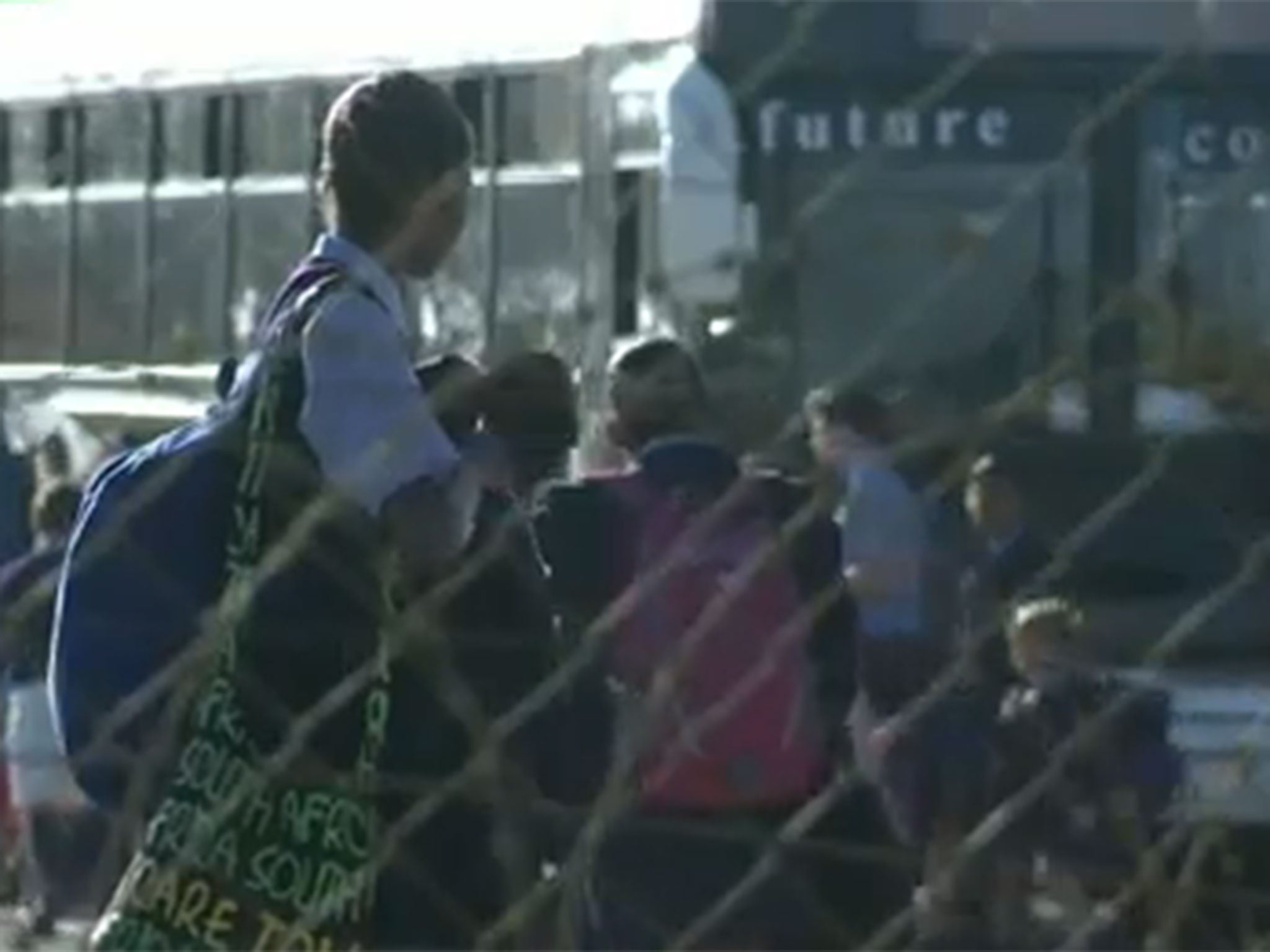 Children wait for a bus at Curro Foundation School in Roodeplaat, Pretoria