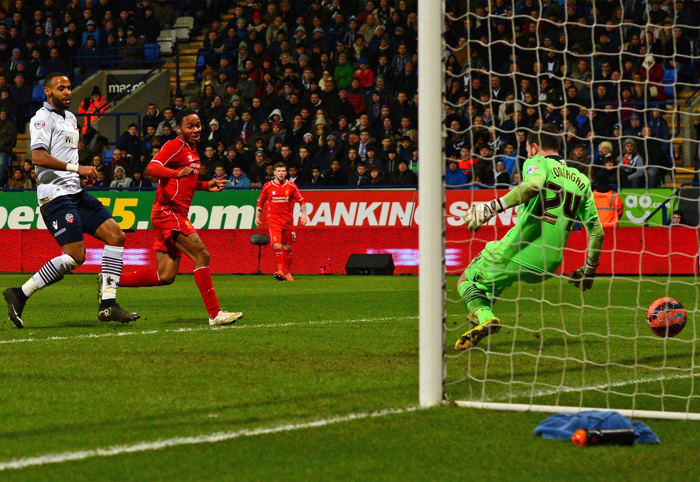 Raheem Sterling scores Liverpool’s equaliser at the Macron Stadium