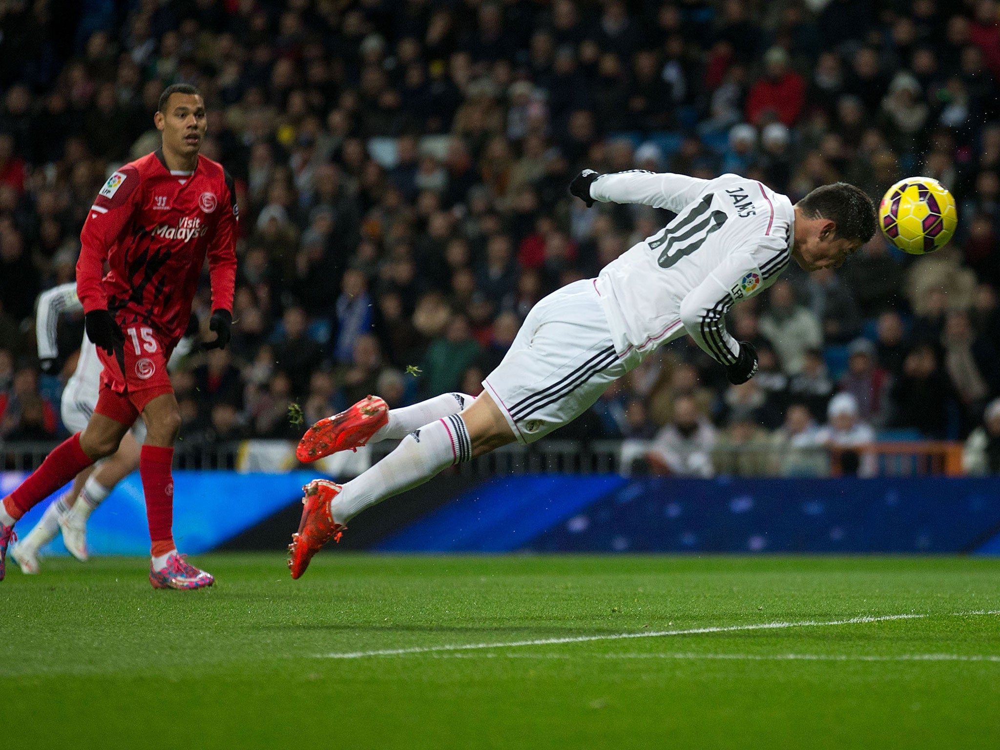 James Rodriguez heads in a goal during the 2-1 win over Sevilla