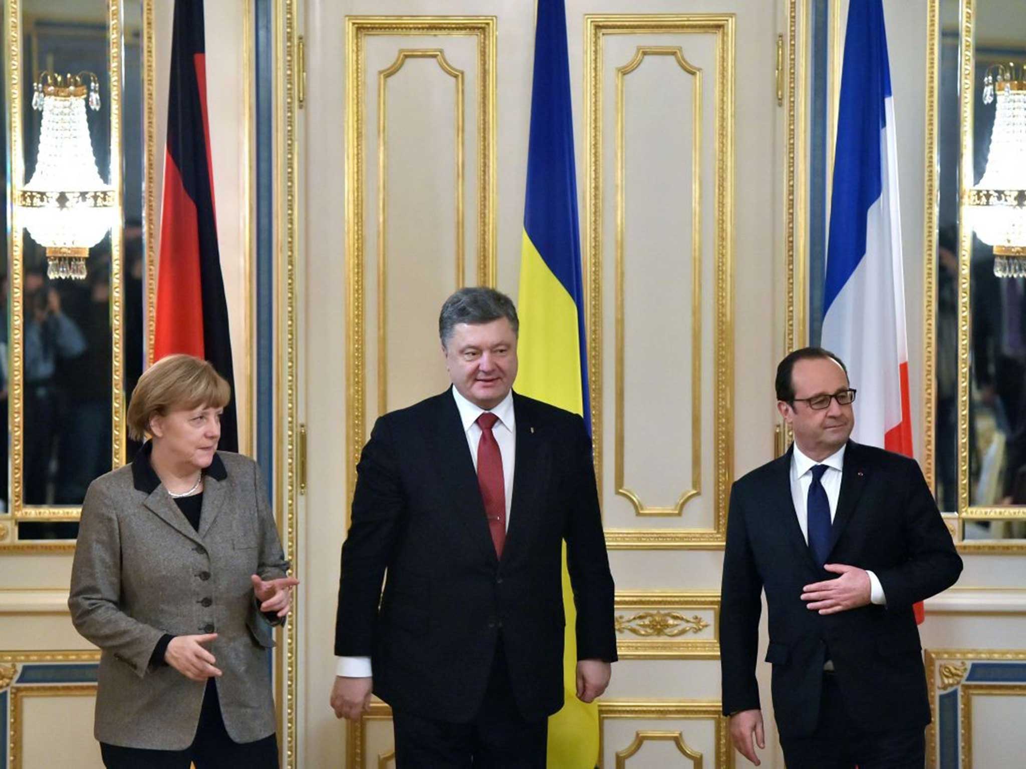 Petro Poroshenko, the Ukrainian President (centre), with Chancellor Angela Merkel of Germany and the French President François Hollande, meet in Kiev to discuss the peace plan