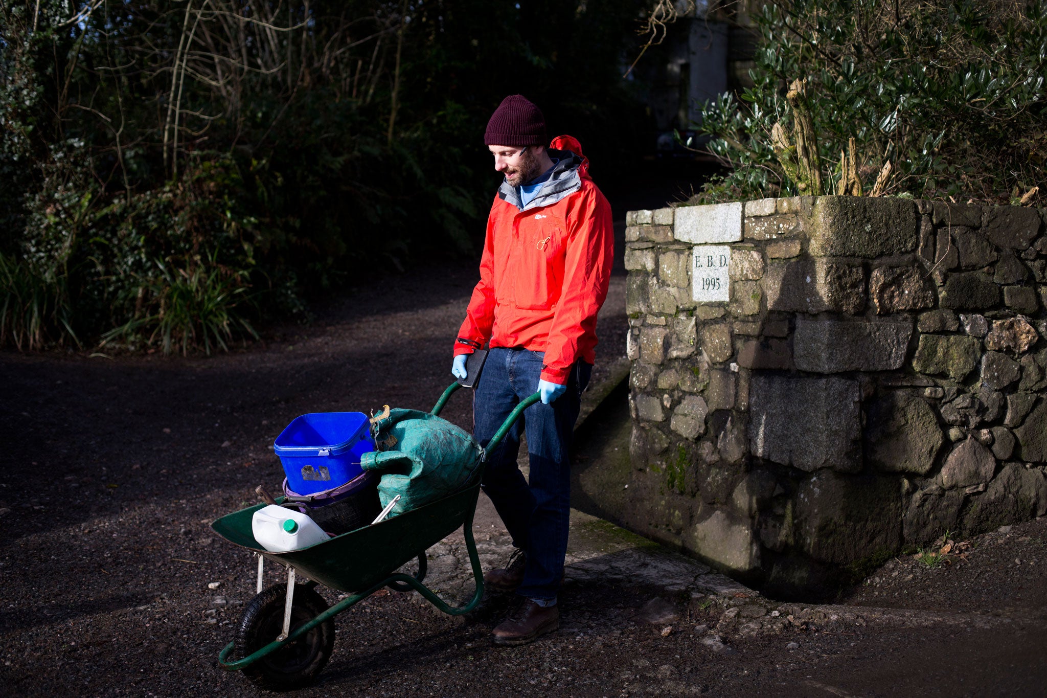 Simon heads out with items needed to feed and clean the animals