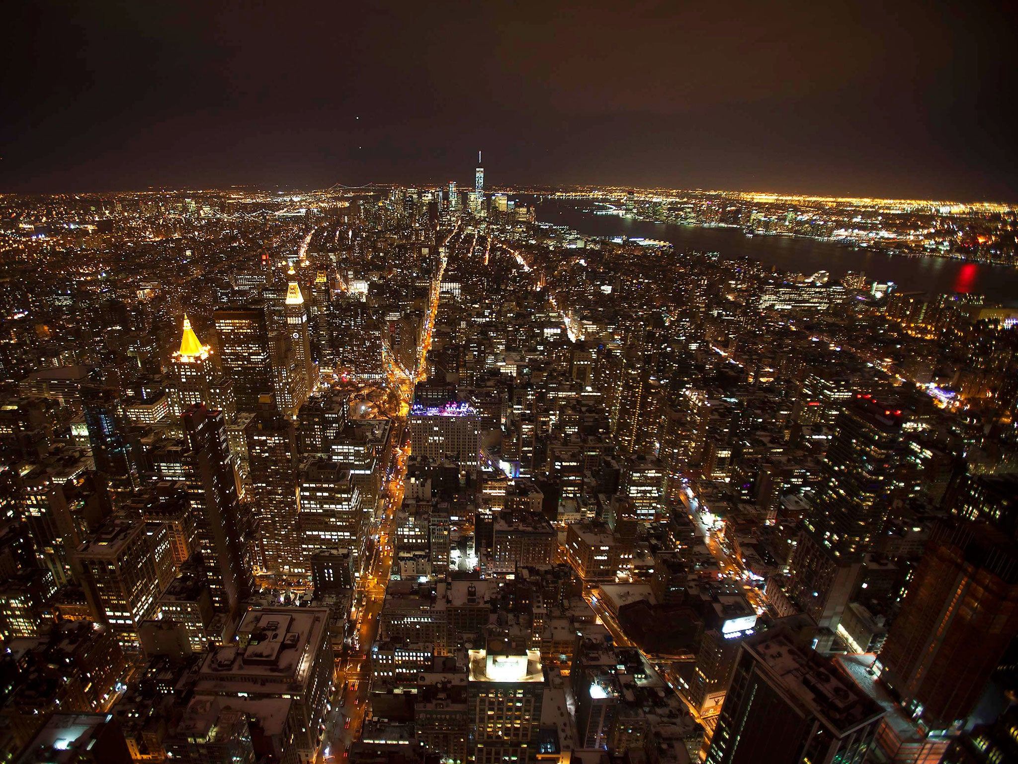 Downtown Manhattan and the One World Trade building are seen from the observation level of the Empire State Building in the Manhattan borough of New York