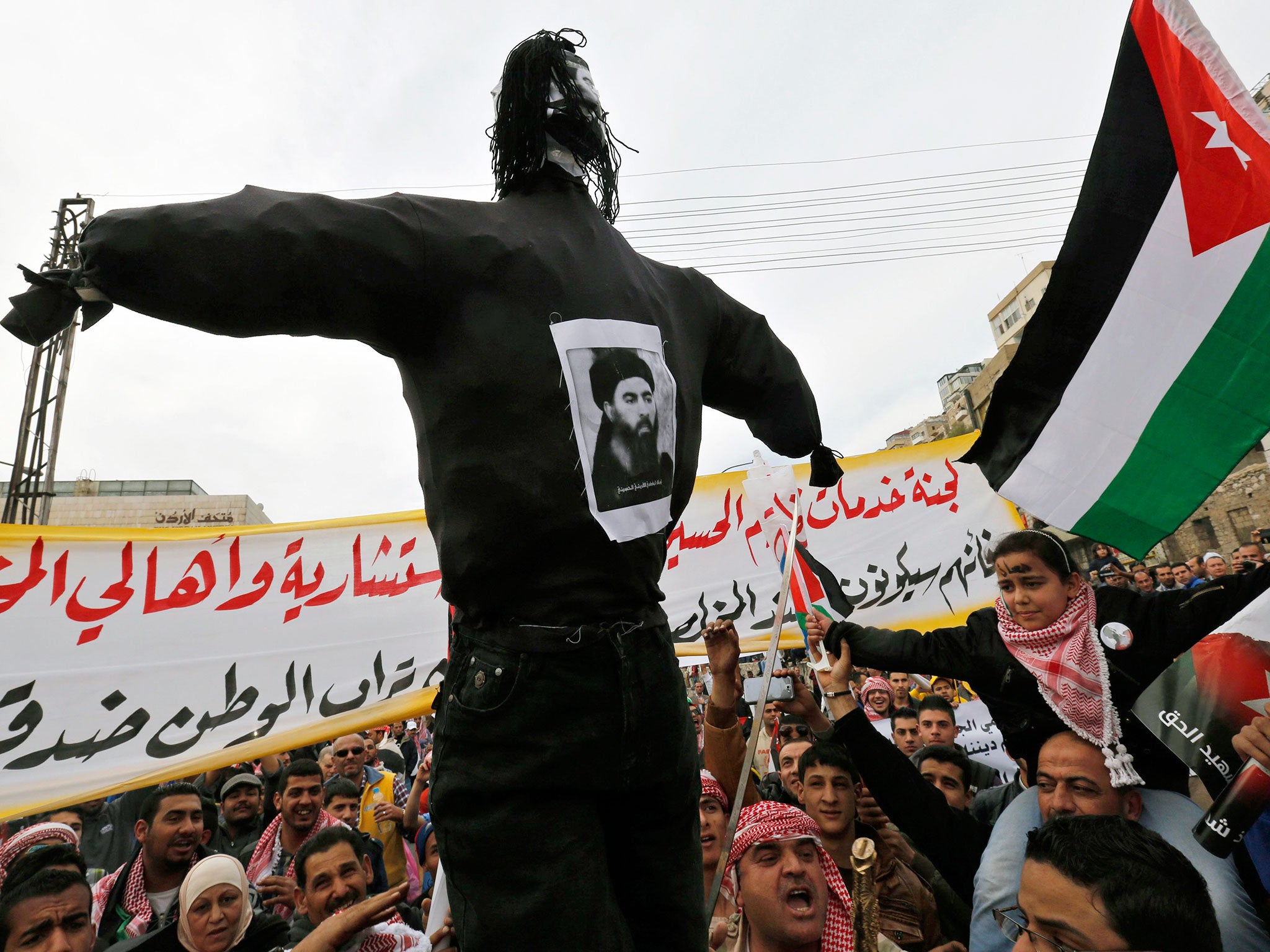 Jordanian protesters carry an effigy of leader of the militant Islamic State Abu Bakr al-Baghdadi