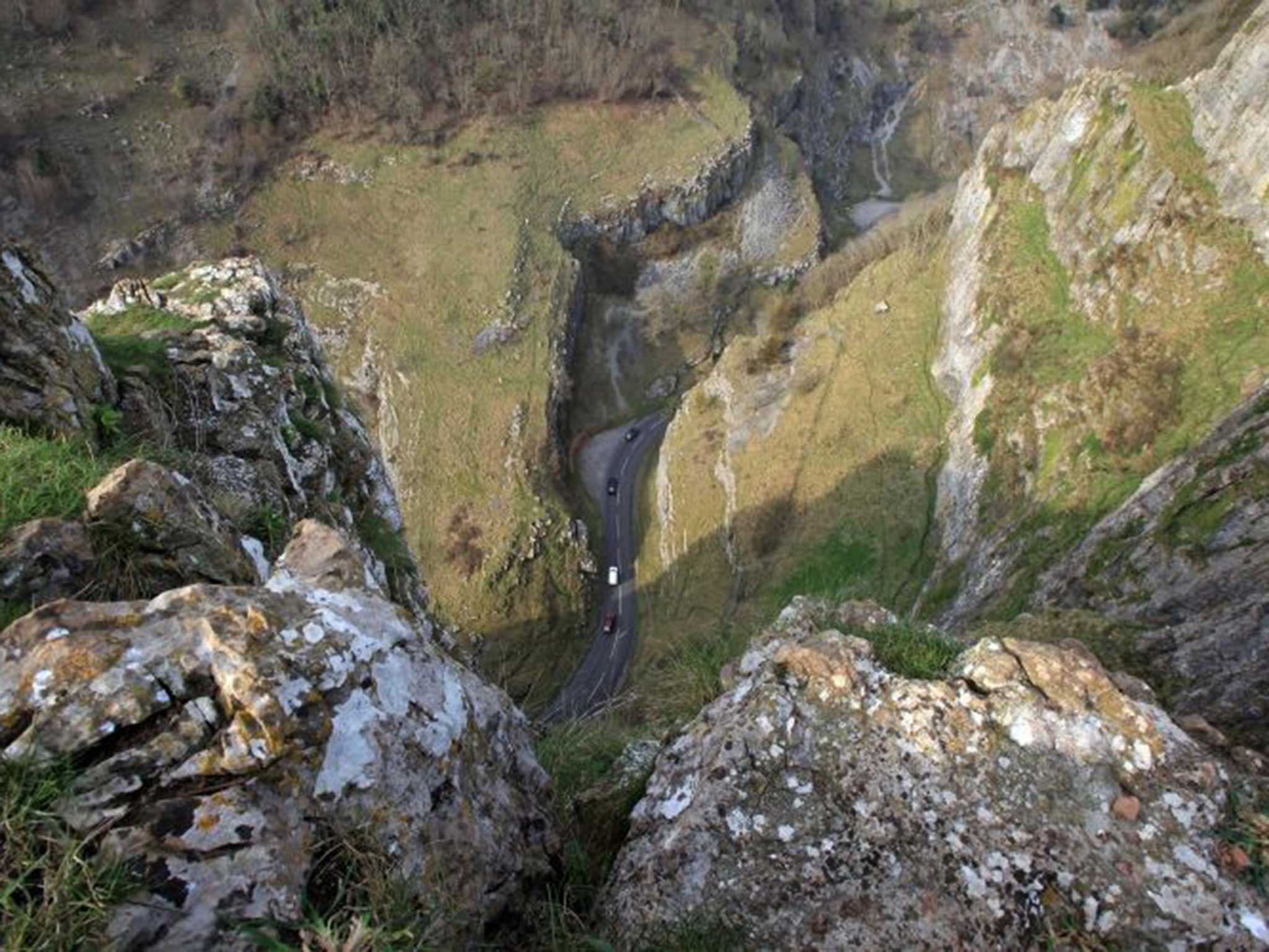 Motorists drive through the Cheddar Gorge