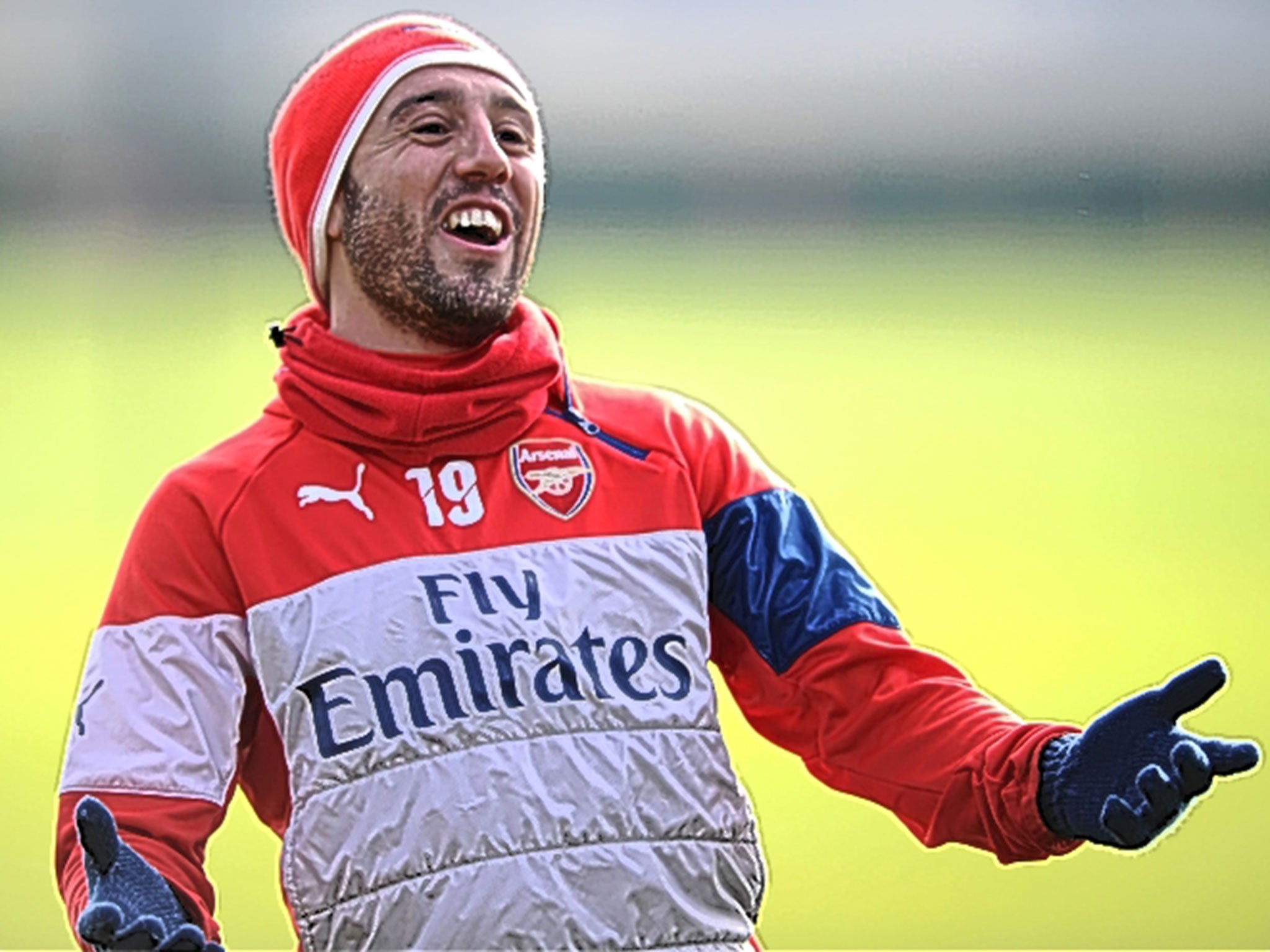 Arsenal's Santi Cazorla enjoys a joke in training yesterday