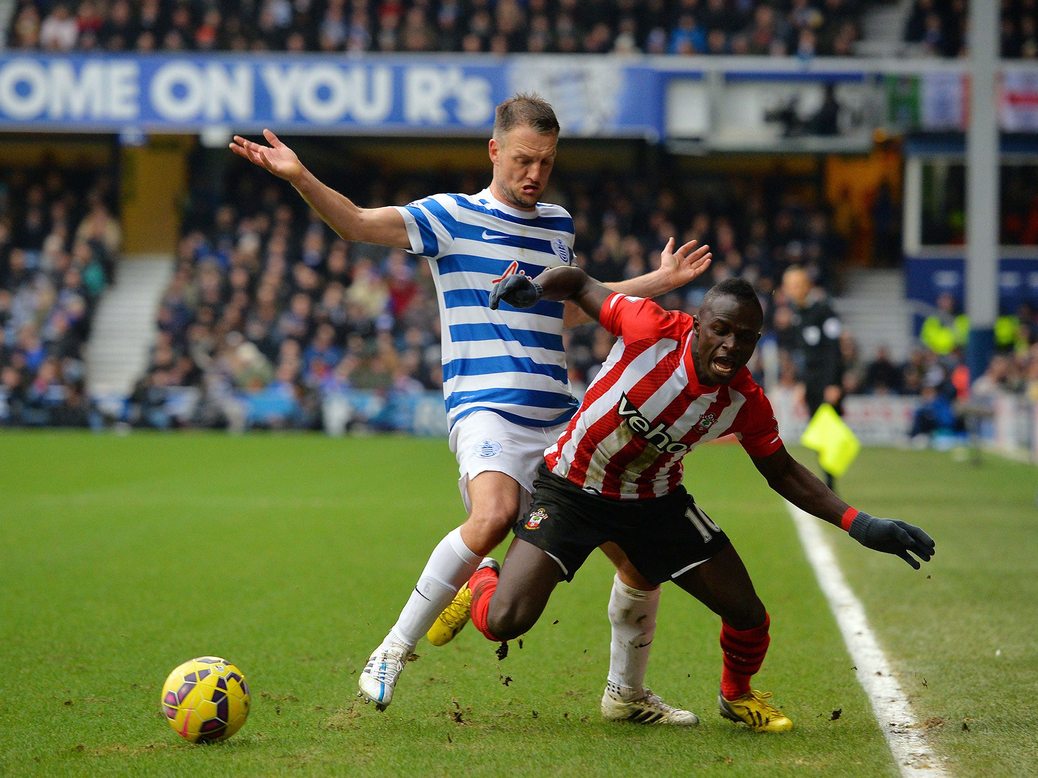 Clint Hill jostles with Sadio Mane