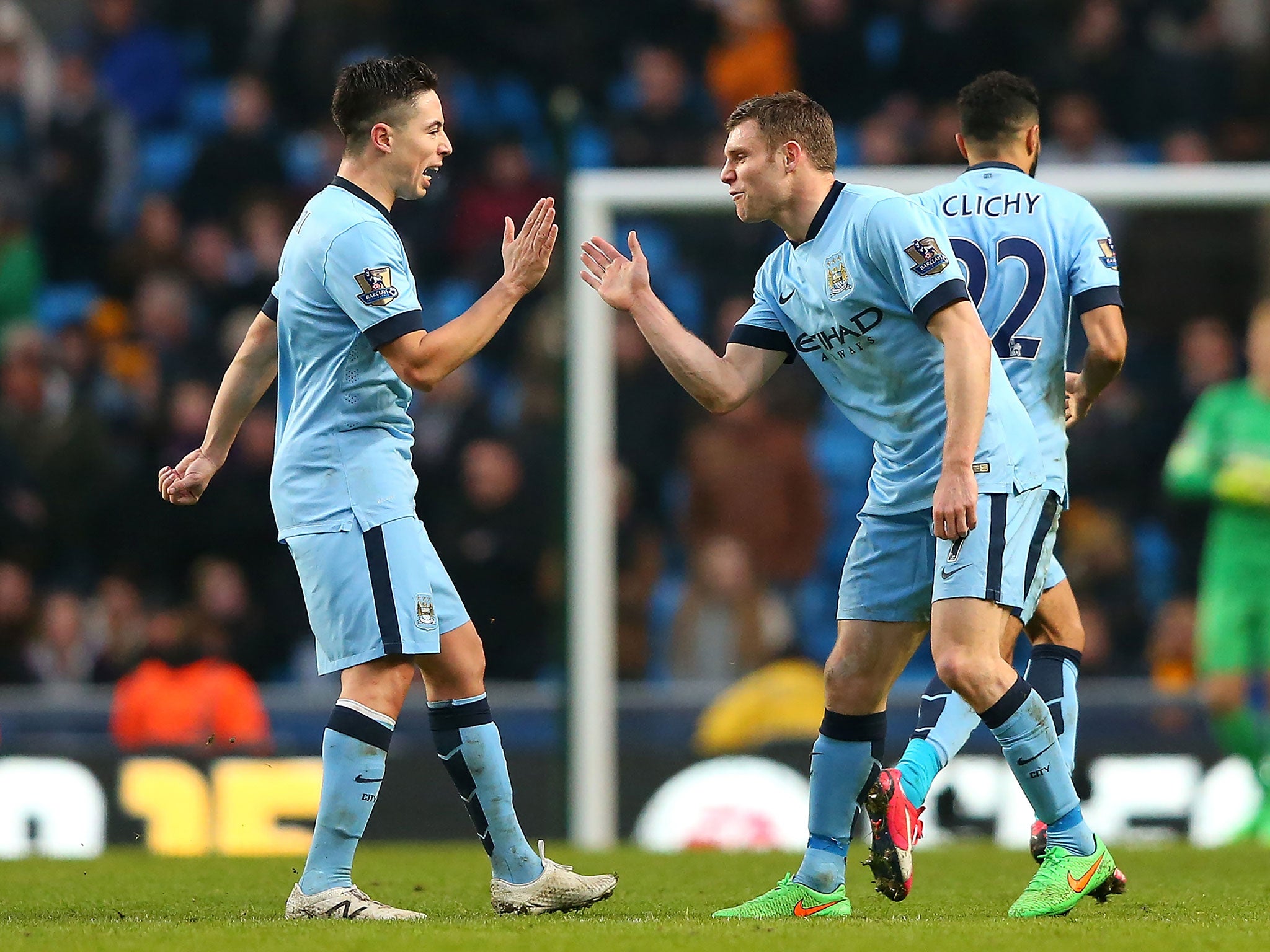 Samir Nasri celebrates with James Milner after the latter scores the equaliser against Hull