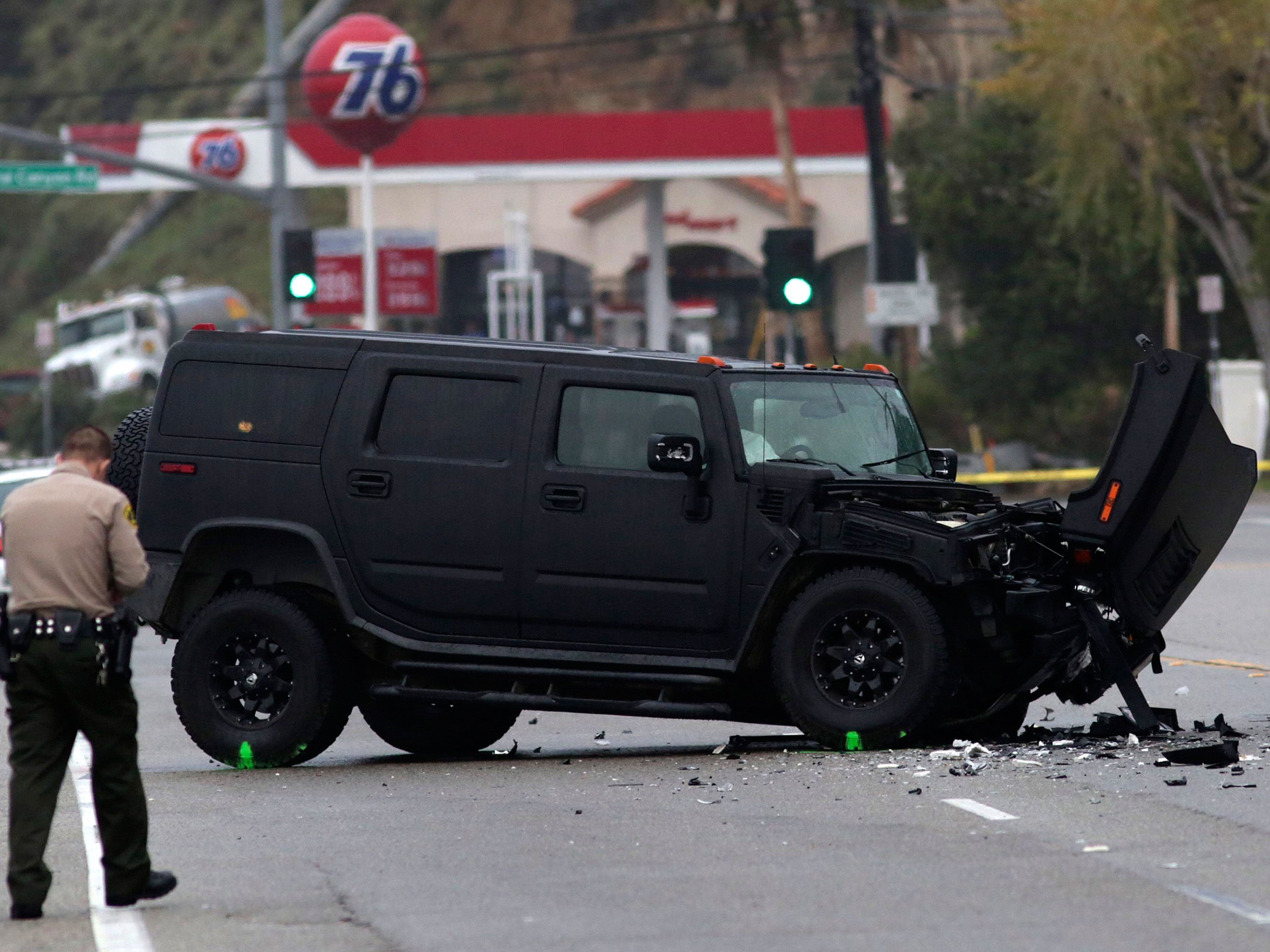 A damaged vehicle is pictured at the scene of the fatal crash