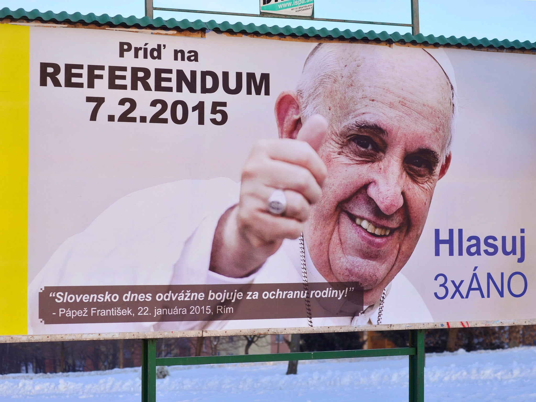 A billboard depicting Pope Francis with his thumb up invites voters to the Slovak national referendum on the protection of the traditional family