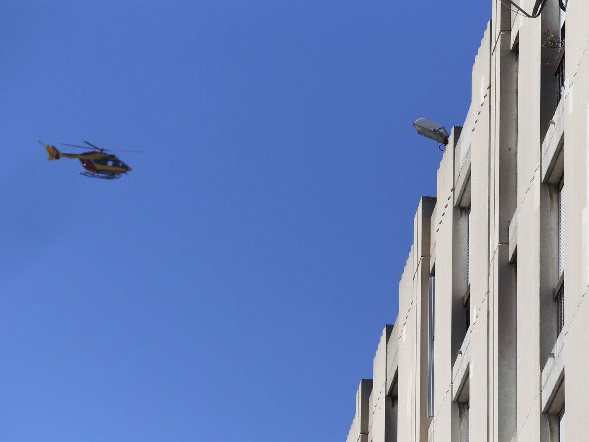 An helicopter of the police forces flies over the 'Cite de la Castellane' northern Marseille