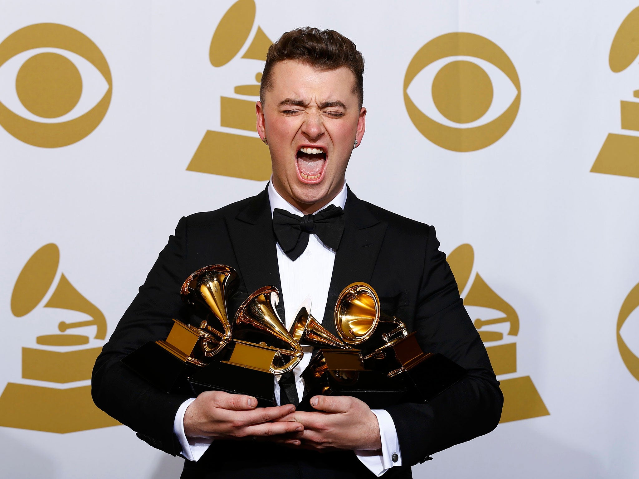 Sam Smith poses with his Grammy awards (Reuters)