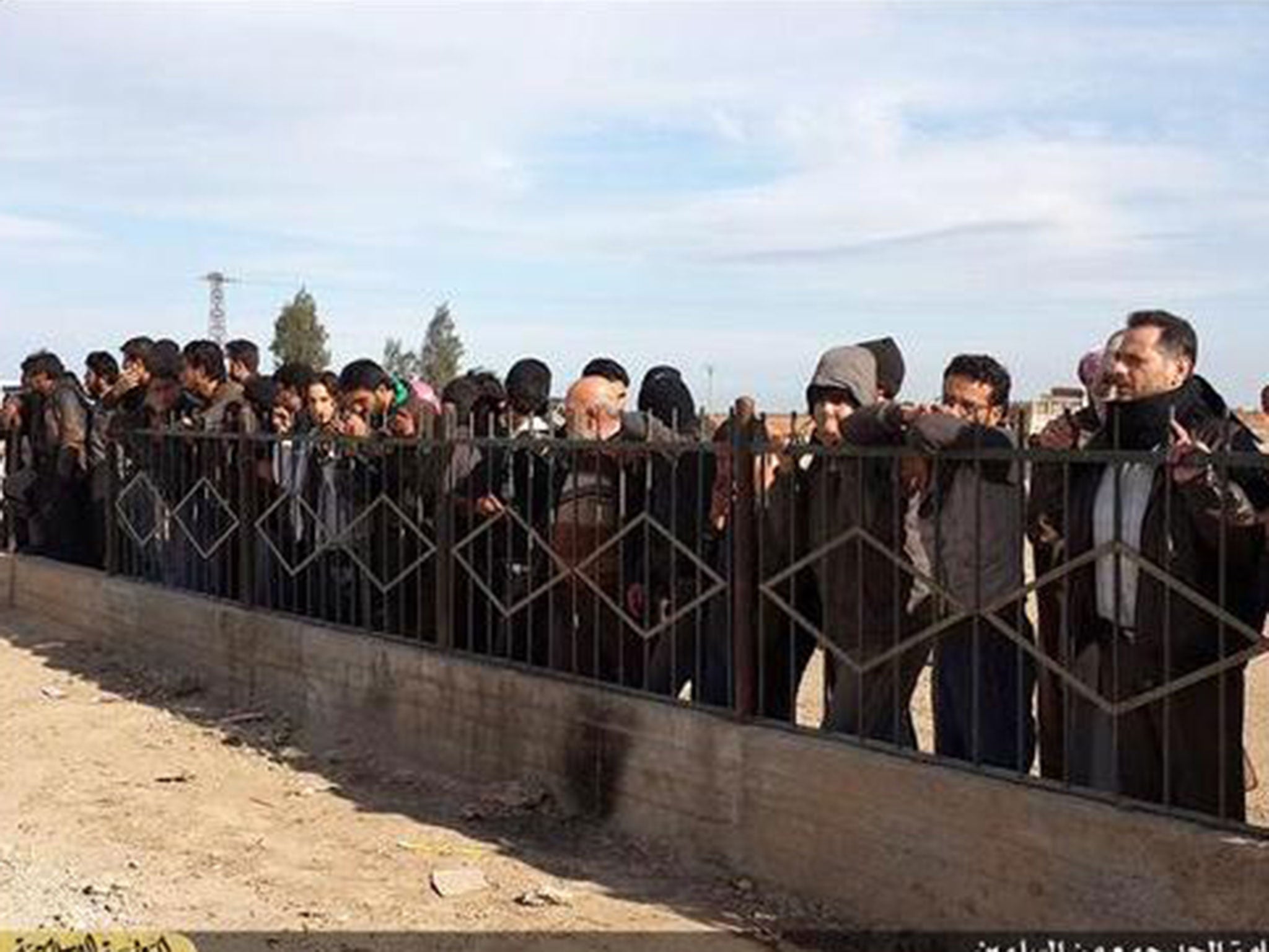 Crowds are shown watching the brutal killing