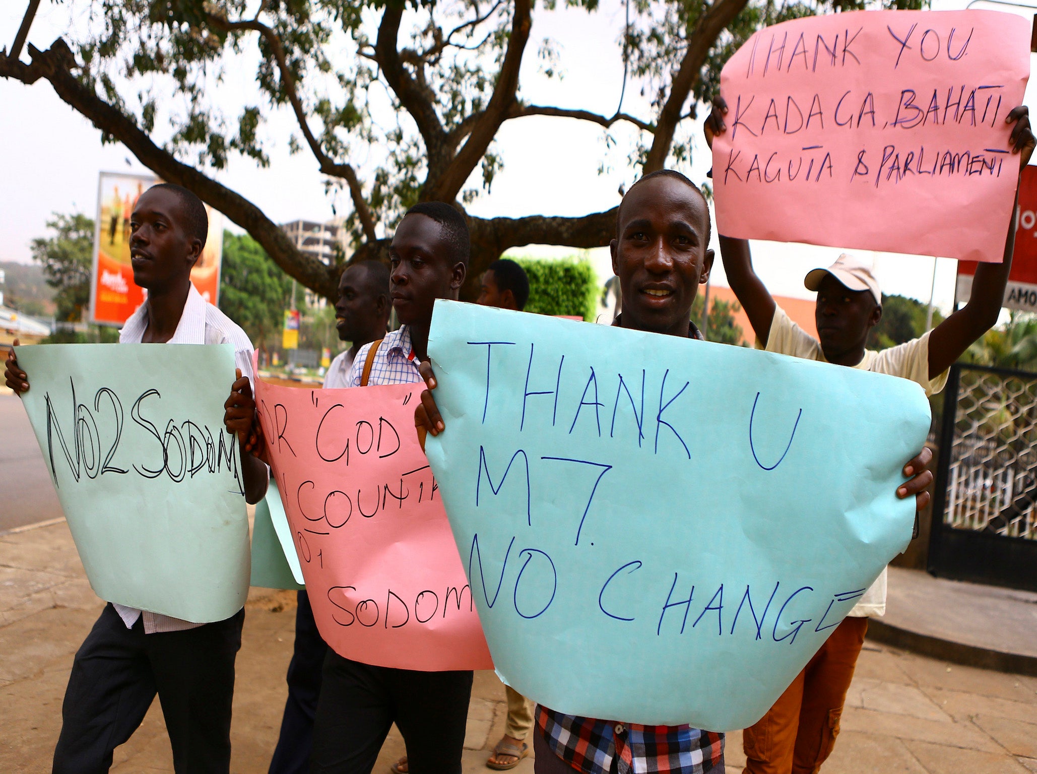 Anti-gay supporters celebrate after Uganda's President Yoweri Museveni signed a law imposing harsh penalties for homosexuality