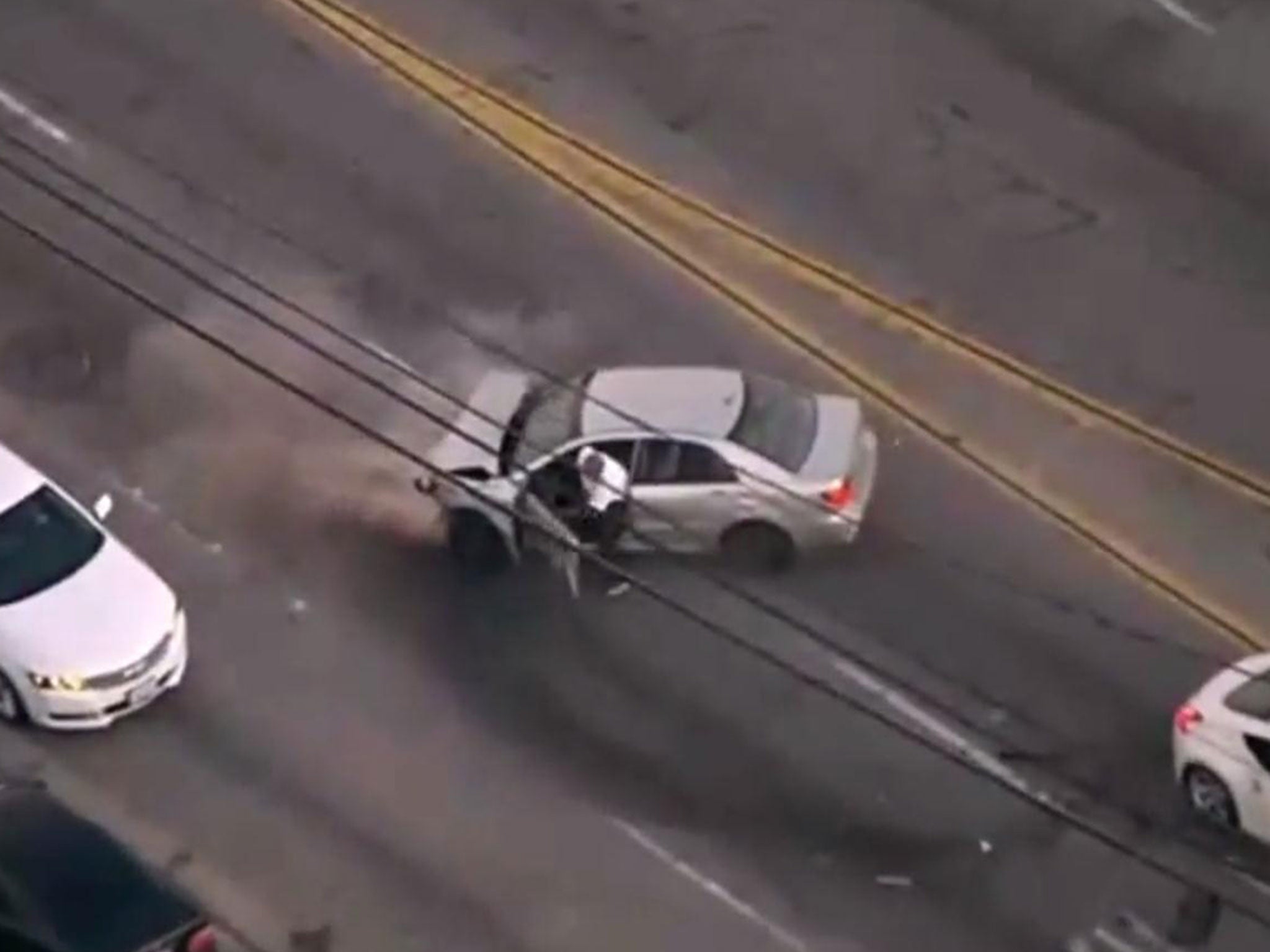 The suspected carjacker fleeing a crashed car