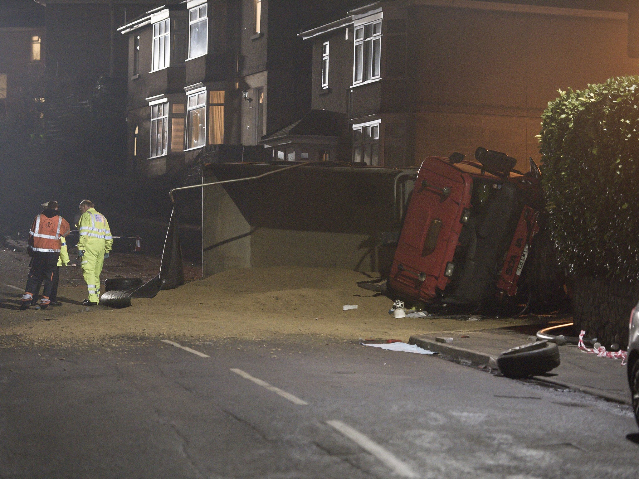 The scene after a tipper truck collided with vehicles and pedestrians on a hill in Lansdown Lane in Bath, Somerset