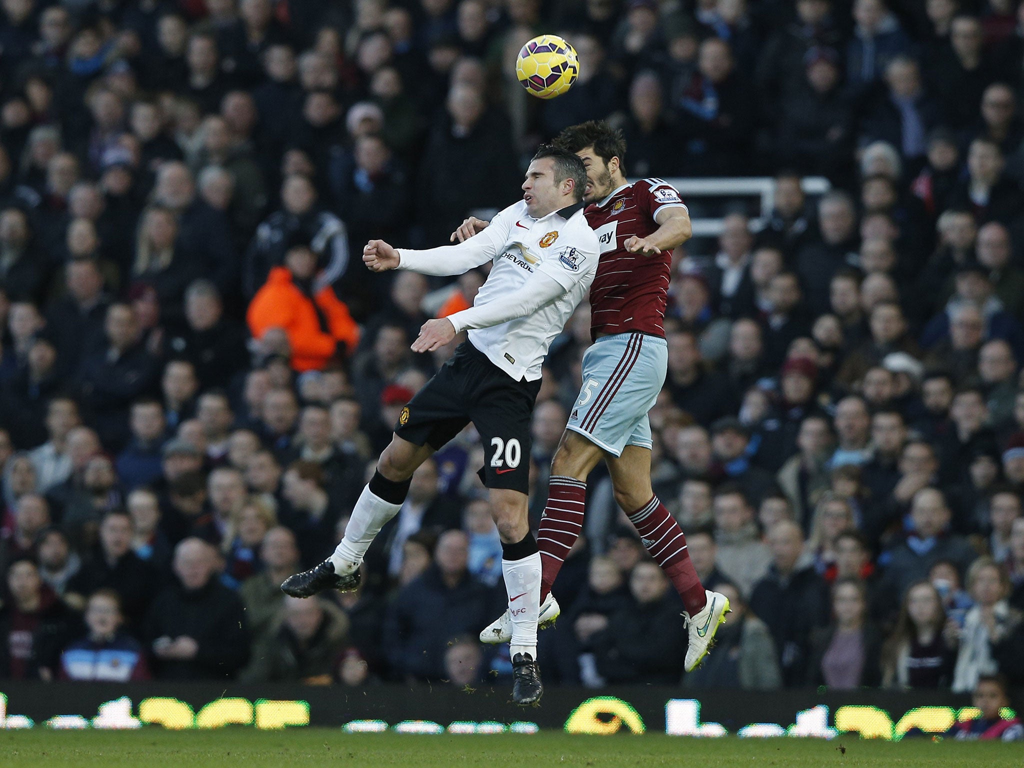 Robin van Persie collides with James Tomkins
