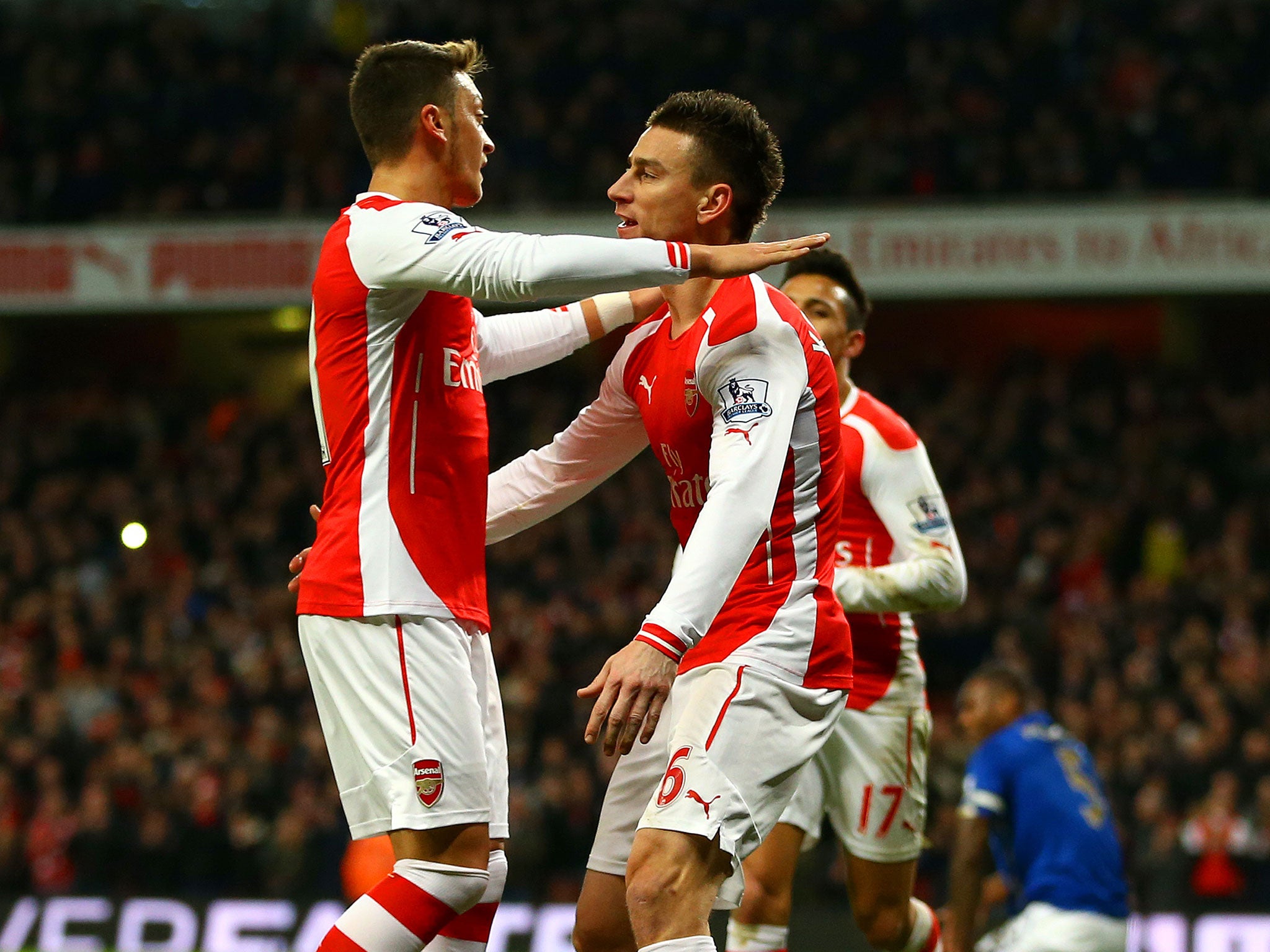 Laurent Koscielny (right) celebrates with Mesut Ozil