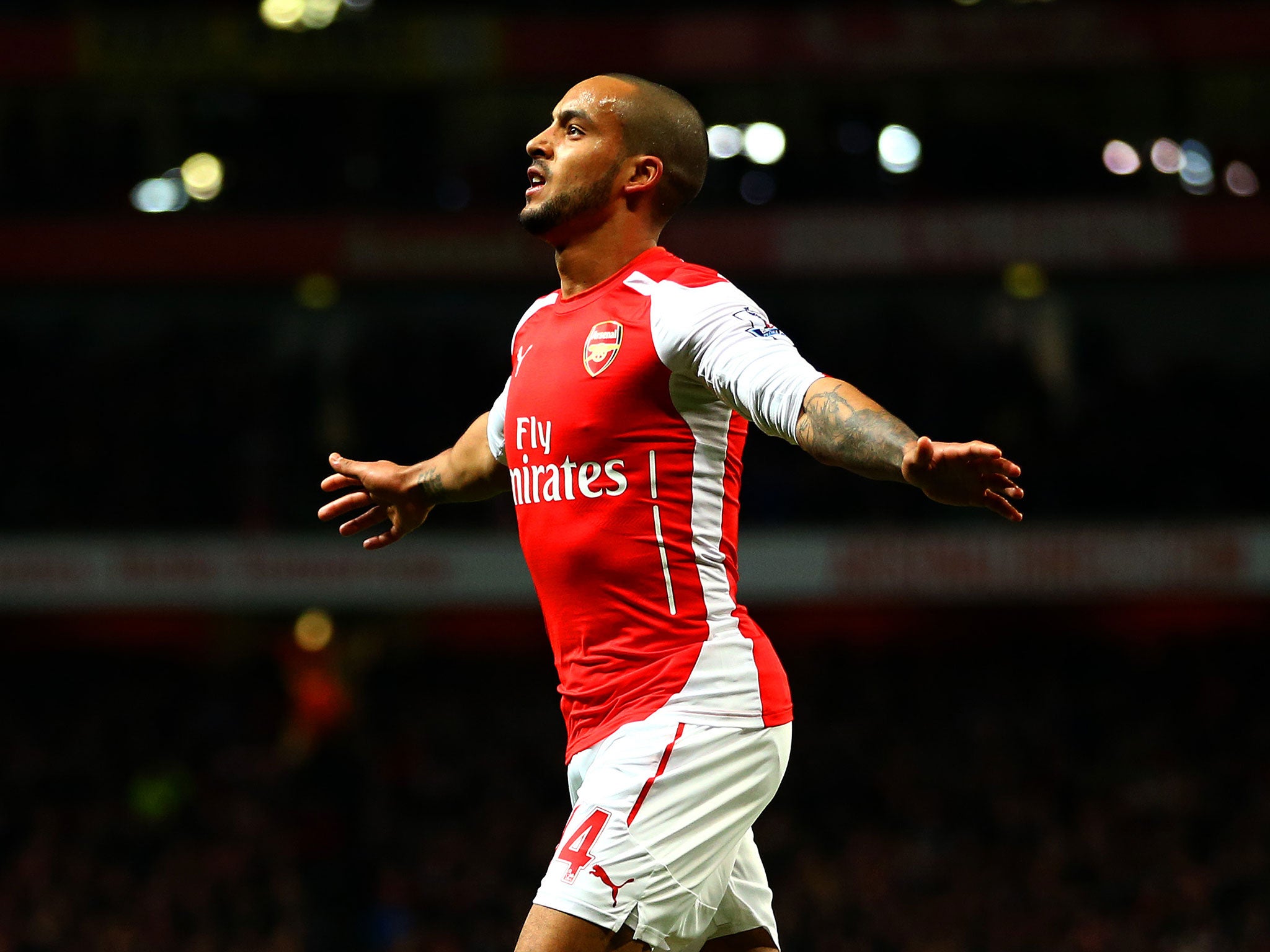 Theo Walcott celebrates for Arsenal