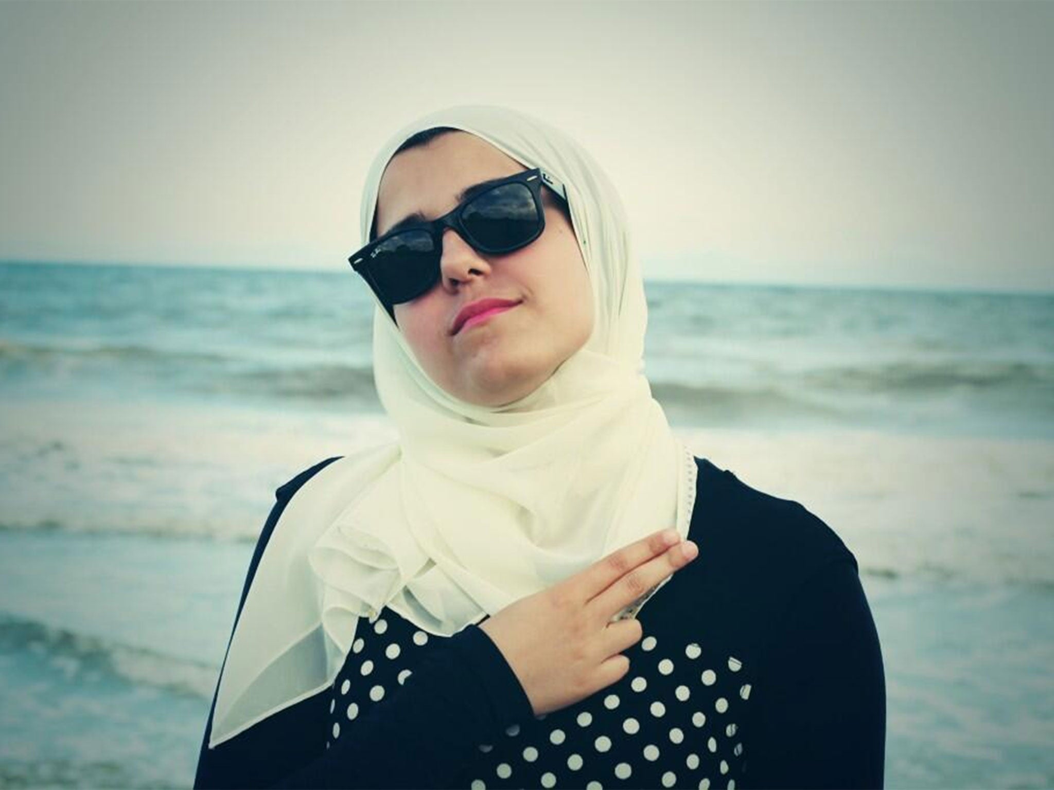 One of the victims, Razan Abu-Salha, pictured in a post by Deah Barakat describing her as 'the best third wheel ever'