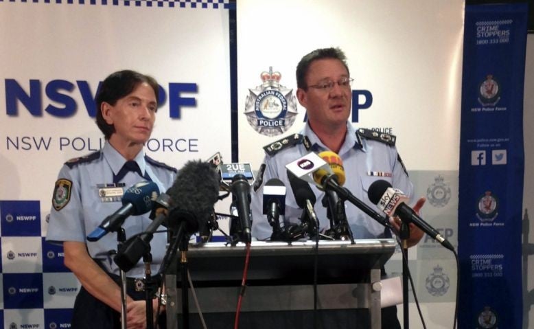 New South Wales Police Deputy Commissioner Catherine Burn (L) and Australian Federal Police Deputy Commissioner Michael Phelan address the media in Sydney on 11 February