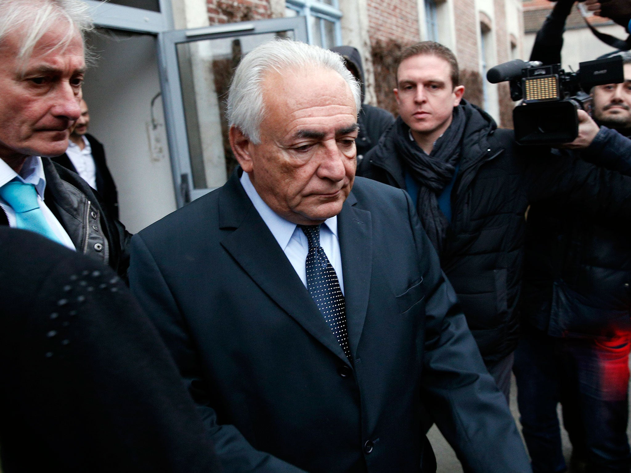 Dominique Strauss Kahn leaves his hotel on his way to the Court Hous in Lille