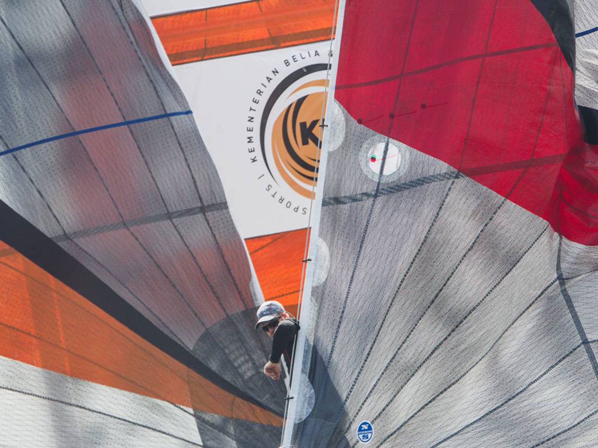 Bowman Pete Nicholas plays peek-a-boo for skipper David Gilmour on a spinnaker run in the World Match Racing Tour Monsoon Cup in Johpr.