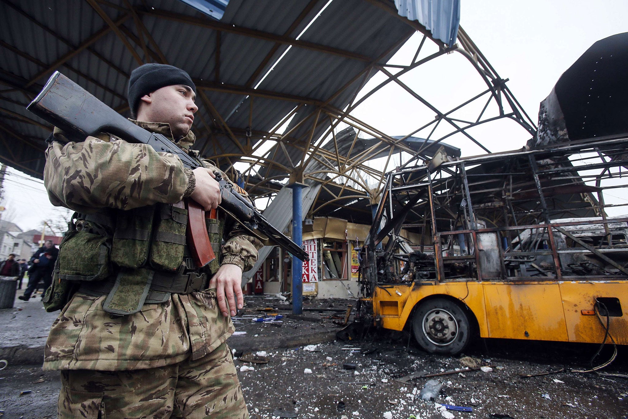 A soldier of the self-proclaimed Donetsk People's Republic, where shelling killed at least one on Tuesday