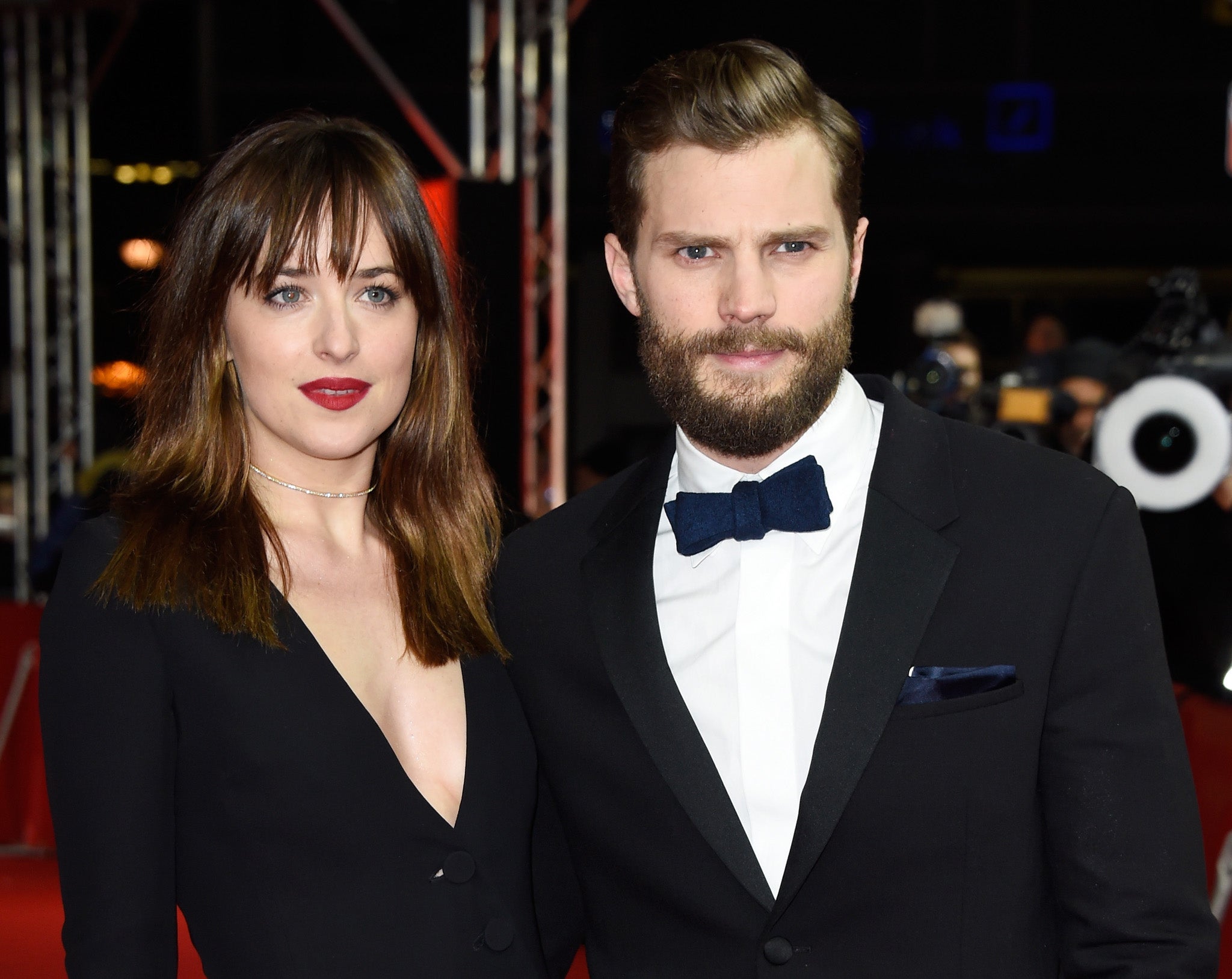 Dakota Johnson and Jamie Dornan on the red carpet at the world premiere of Fifty Shades of Grey