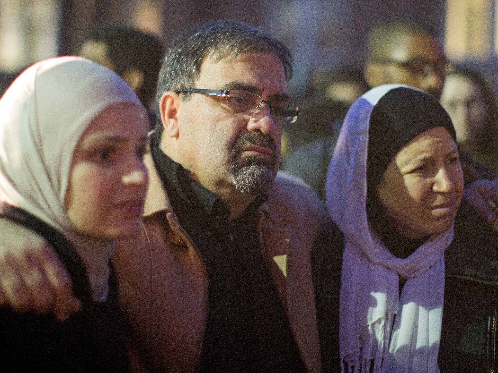 Namee Barakat with his wife Layla (R) and daughter Suzanne, family of shooting victim Deah Shaddy Barakat