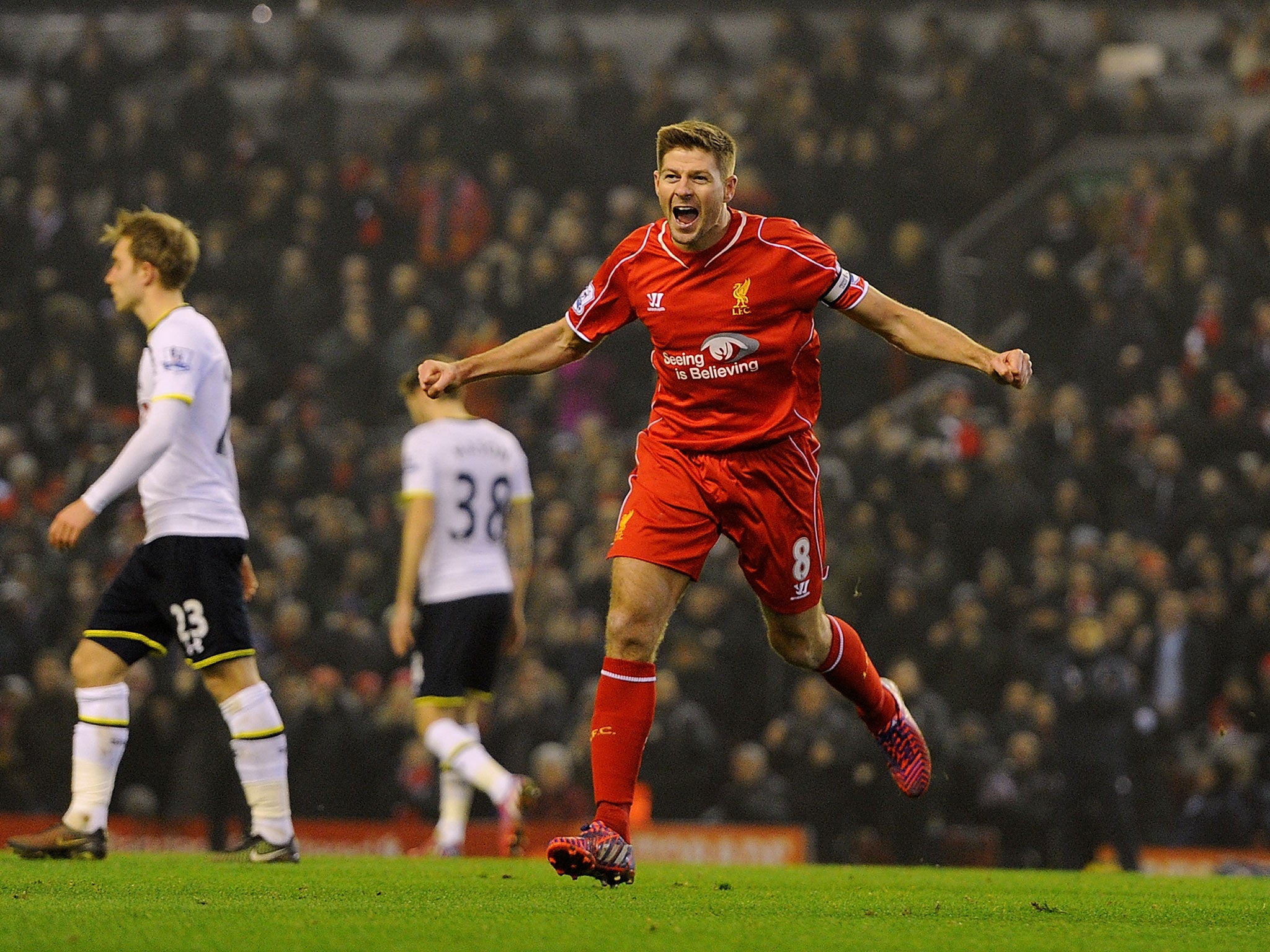 Gerrard celebrates scoring against Spurs