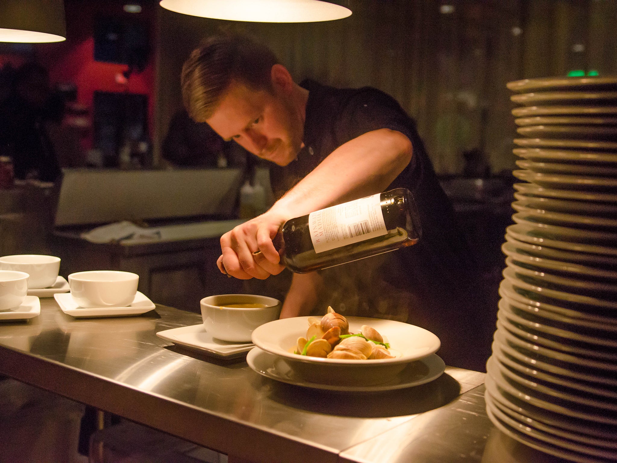 Putting the final touches to a dish at Cochon