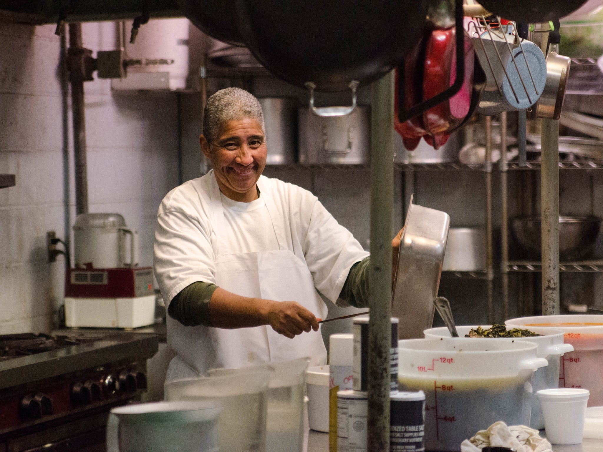 Serving up soul food in the kitchen of a restaurant in New Orleans