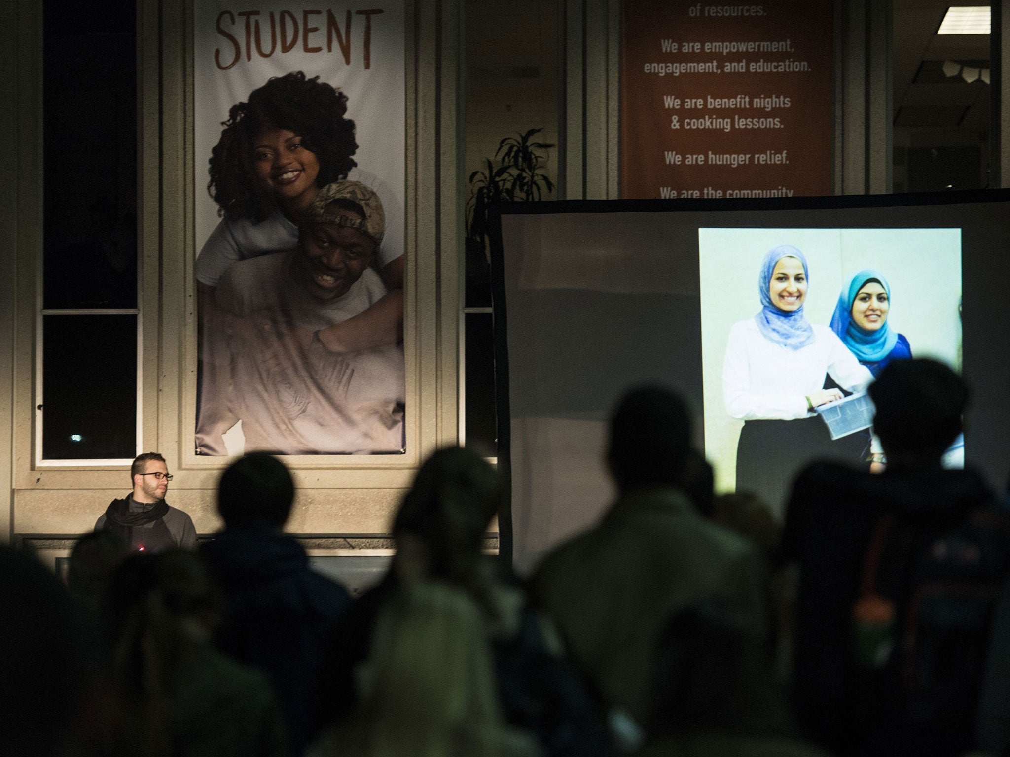 Loved ones speak during the vigil (Getty Images)