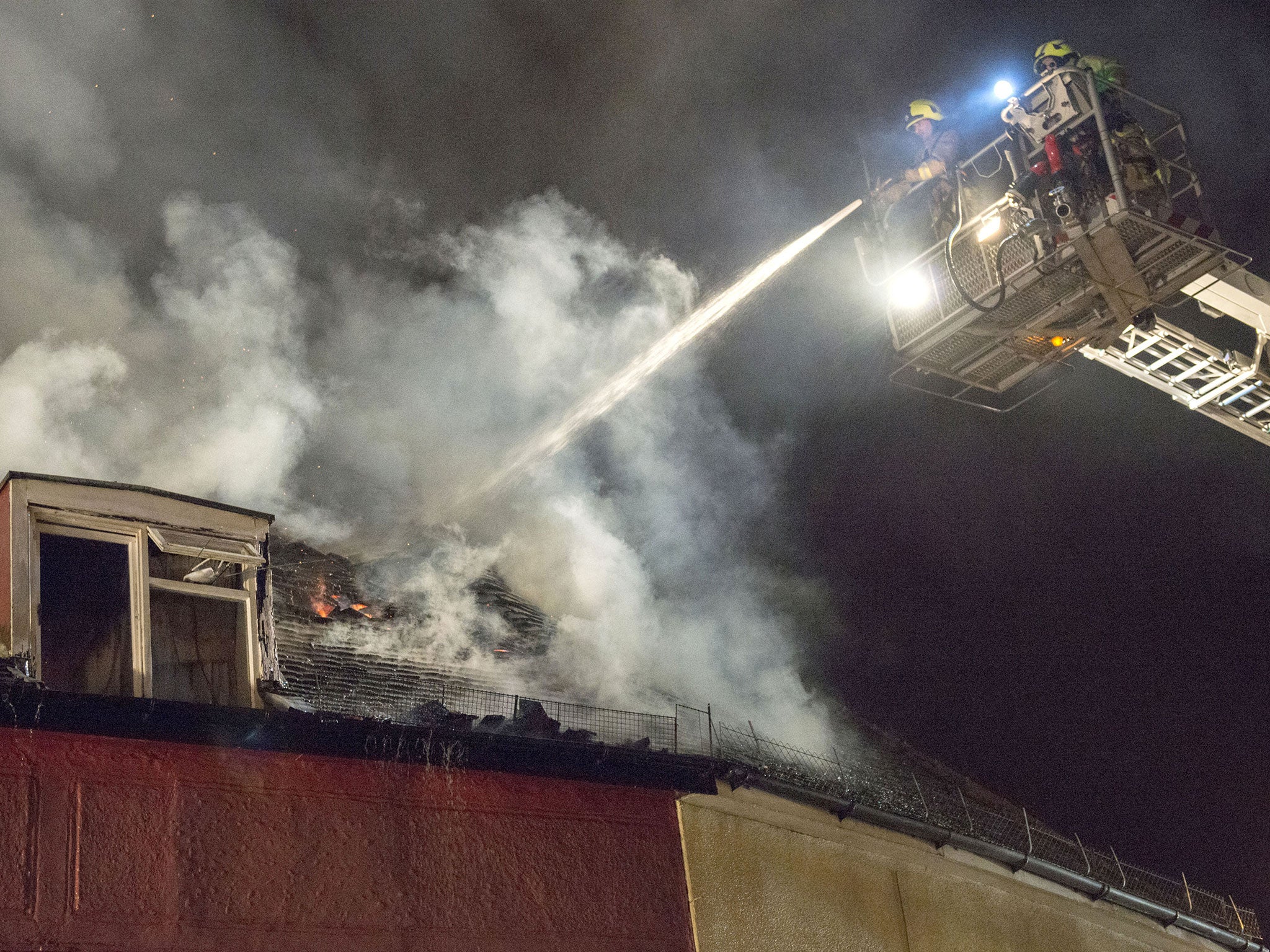 Firefighters at a fire in Braintree, Essex, where a quick-thinking bus driver came to the rescue by manoeuvring his vehicle to help a naked man escape from the burning building