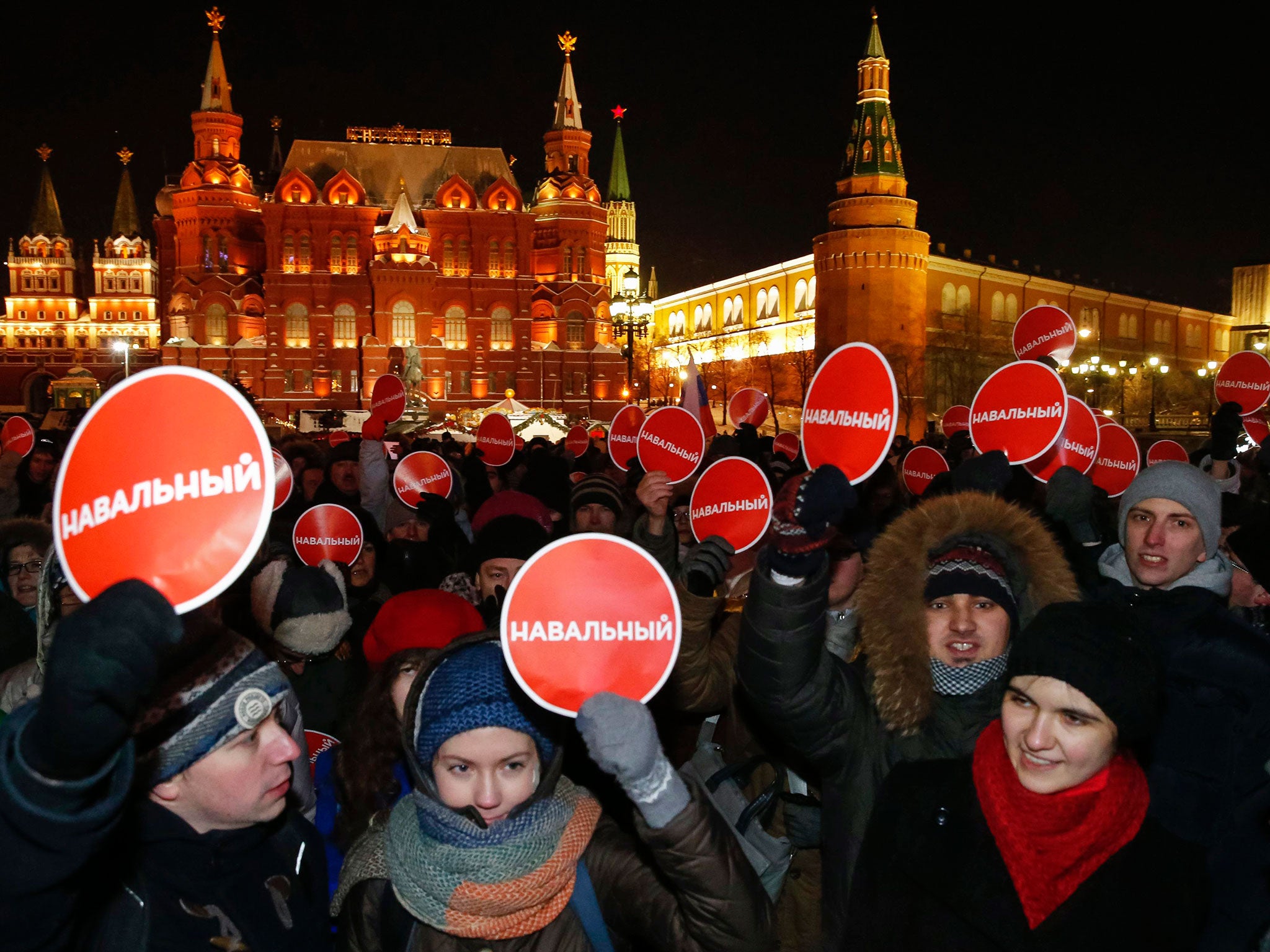 Supporters of Russian opposition leader and anti-corruption blogger Alexei Navalny hold a rally in protest against court verdict at Manezhnaya Square in Moscow