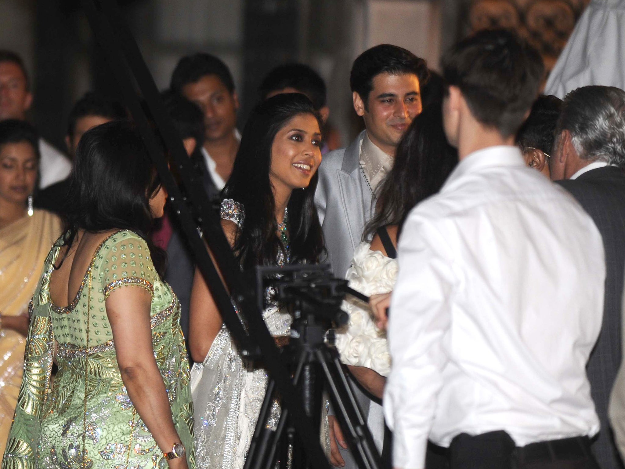 Vinita Agarwal (centre), arrives at her wedding with her fiancé Muqit Teja in 2011. Shakira sang for guests