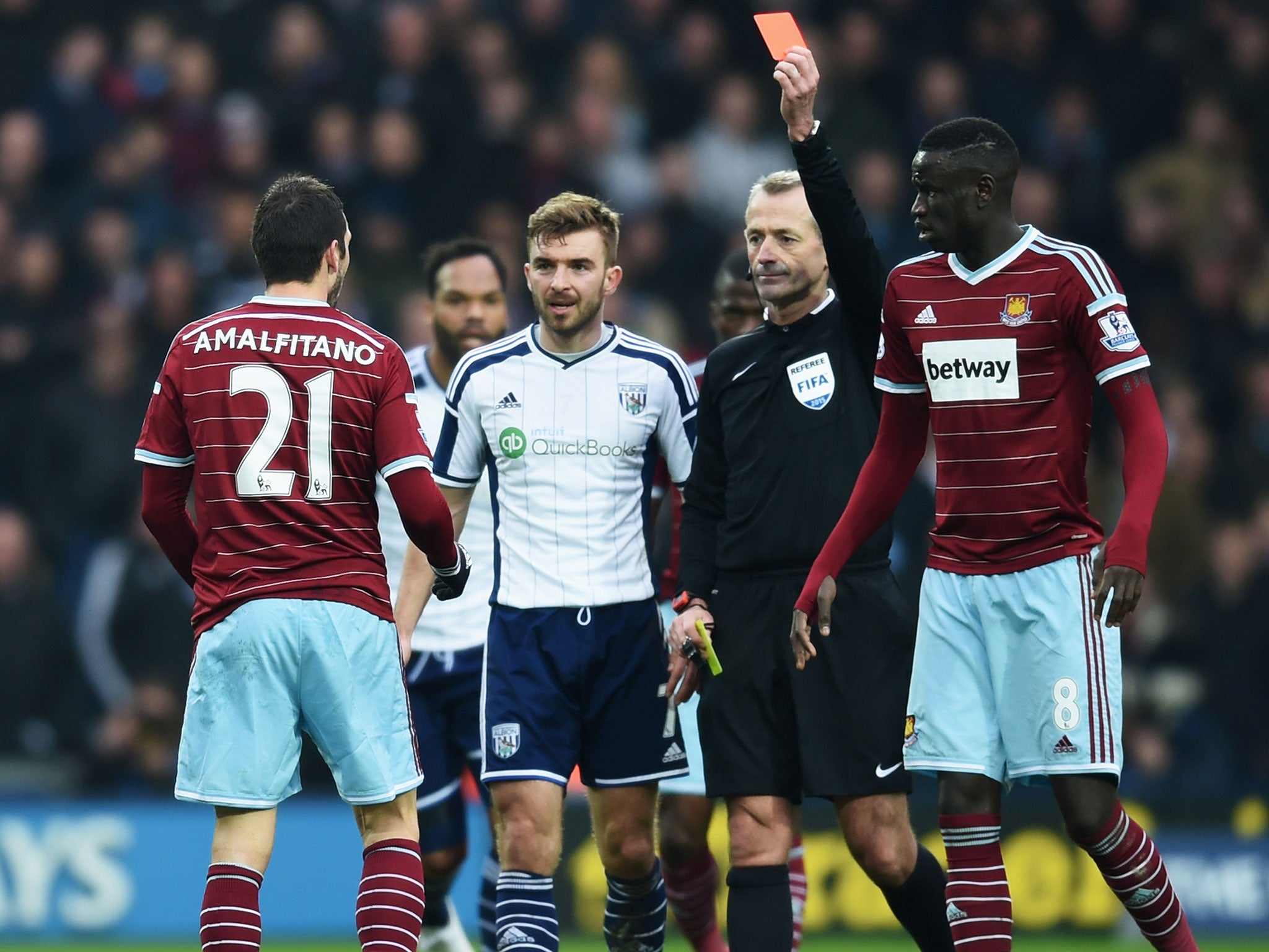 Morgan Amafitano his shown a red card by referee Martin Atkinson