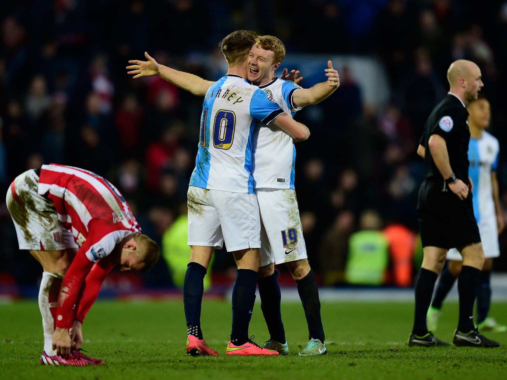 Blackburn players Tom Cairney (l) and Chris Taylor celebrate after the FA Cup Fifth round