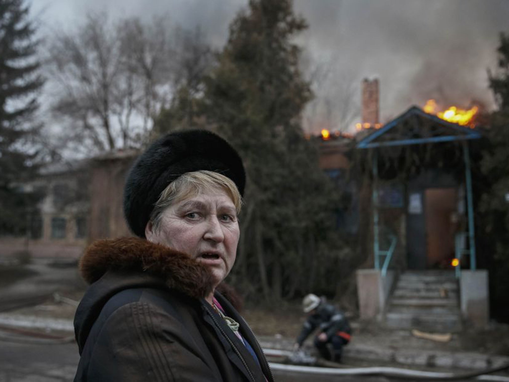 A woman witnesses shelling in the town