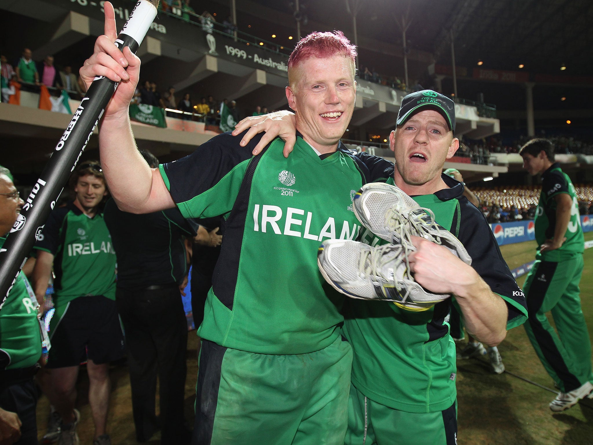 Kevin O’Brien (left) celebrates with Niall O’Brien after Ireland beat England in 2011