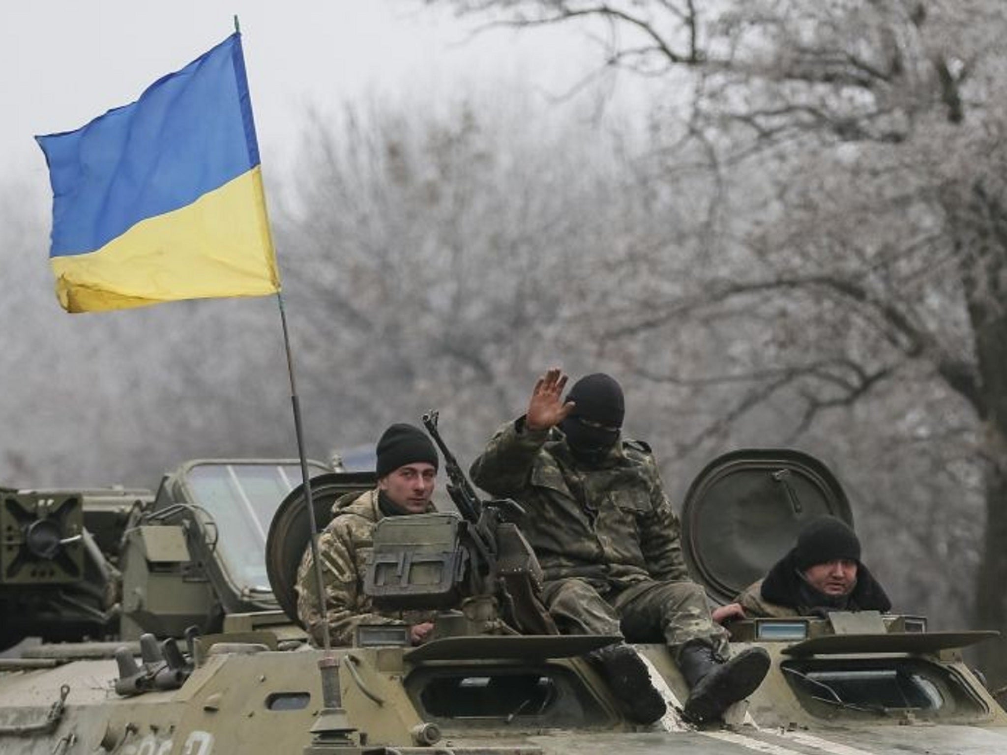 Ukrainian armed forces ride on a military vehicle near Artemivsk, eastern Ukraine