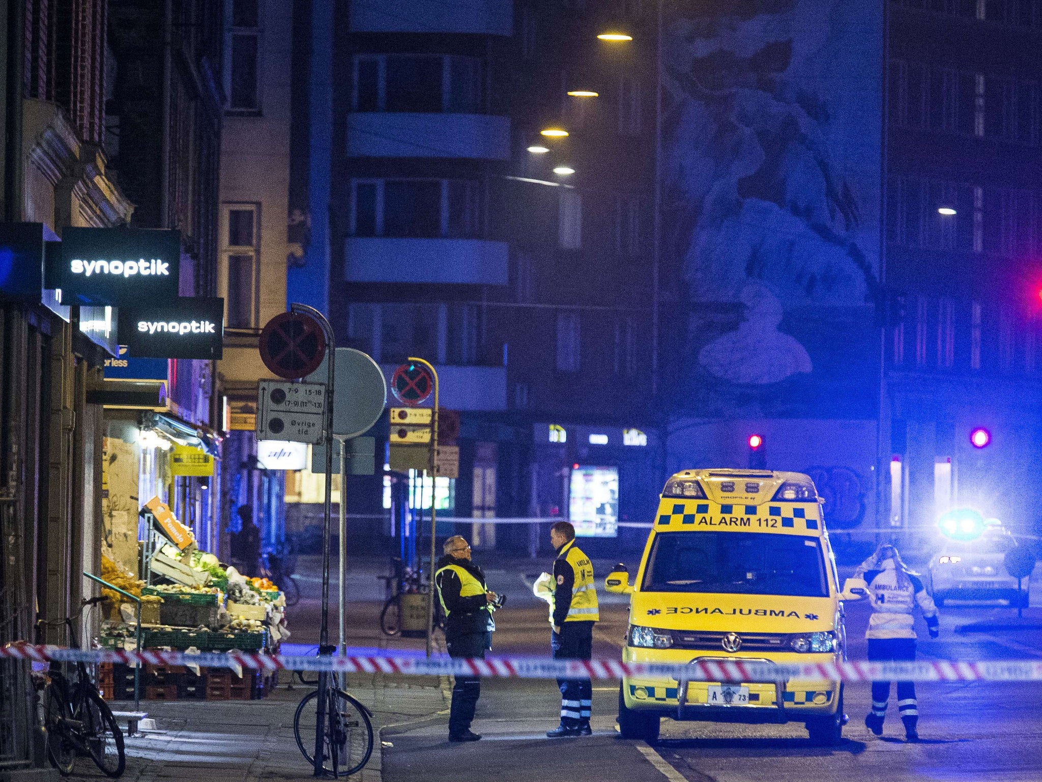 Police work at Frederikssundsvej and Svanevej, close to Norrebro Station, where the suspected gunman was shot and killed