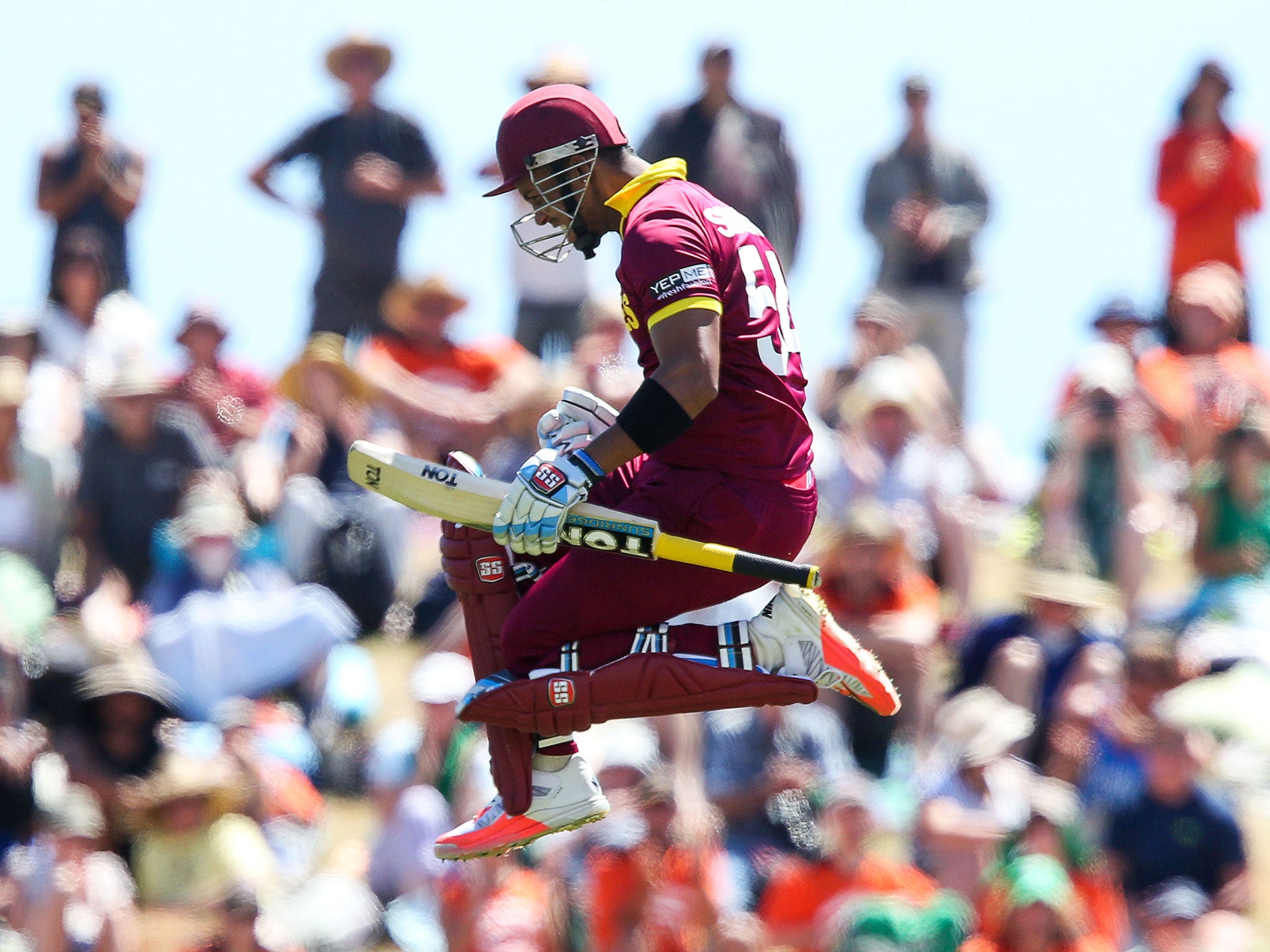 Lendl Simmons leaps in joy after hitting a century against Ireland