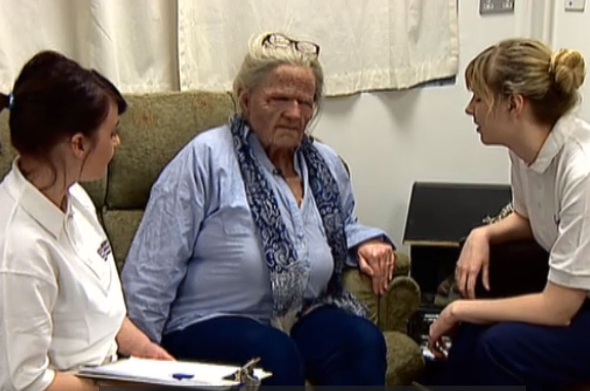 Trainees at Robert Gordon University speak to a 'patient' - a tutor dressed in one of the masks