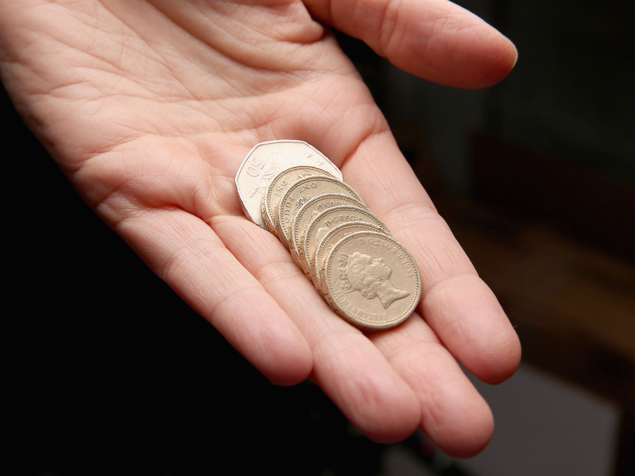 A man holds coins