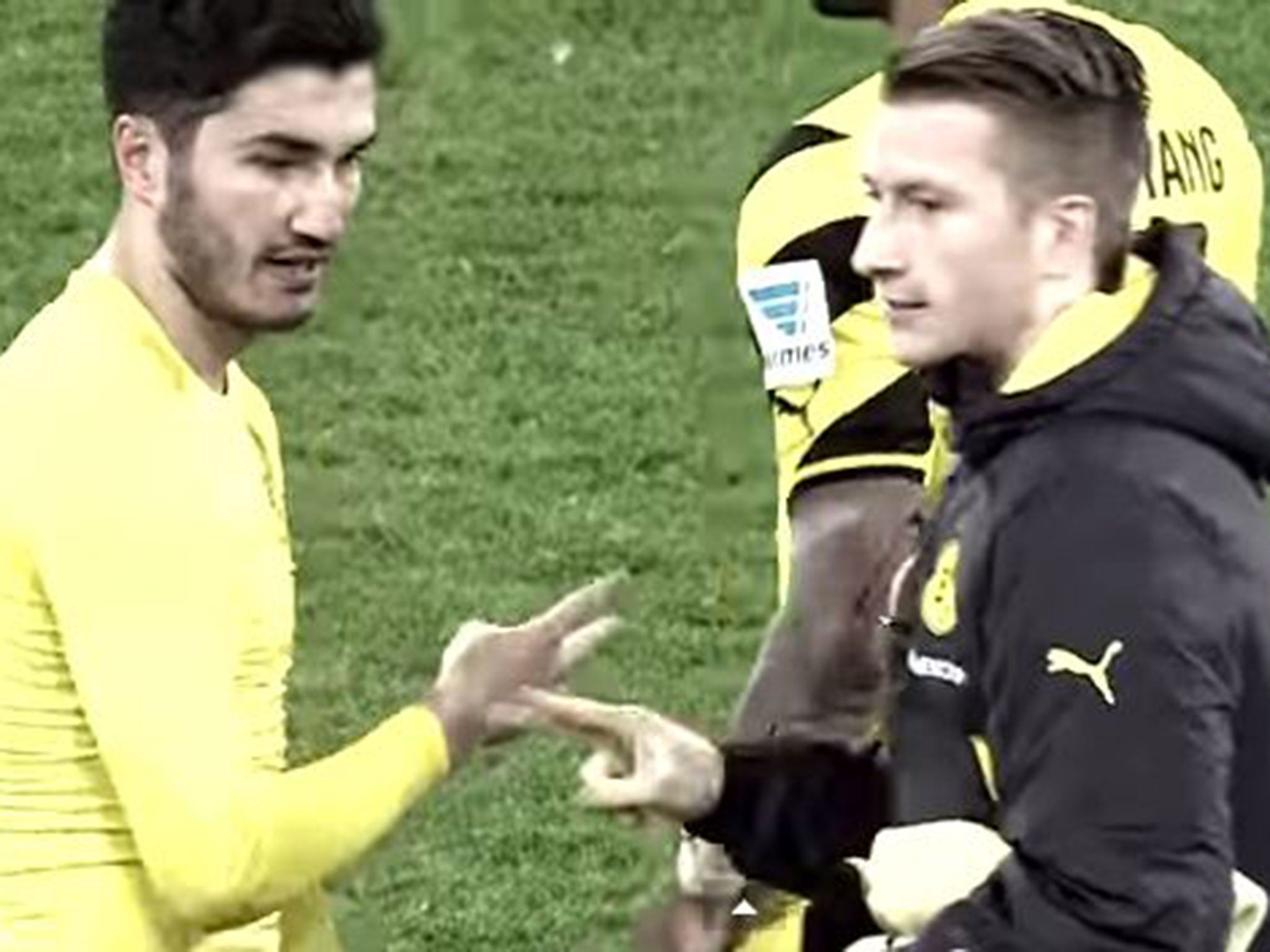 Marco Reus and Nuri Sahin shake hands after the match