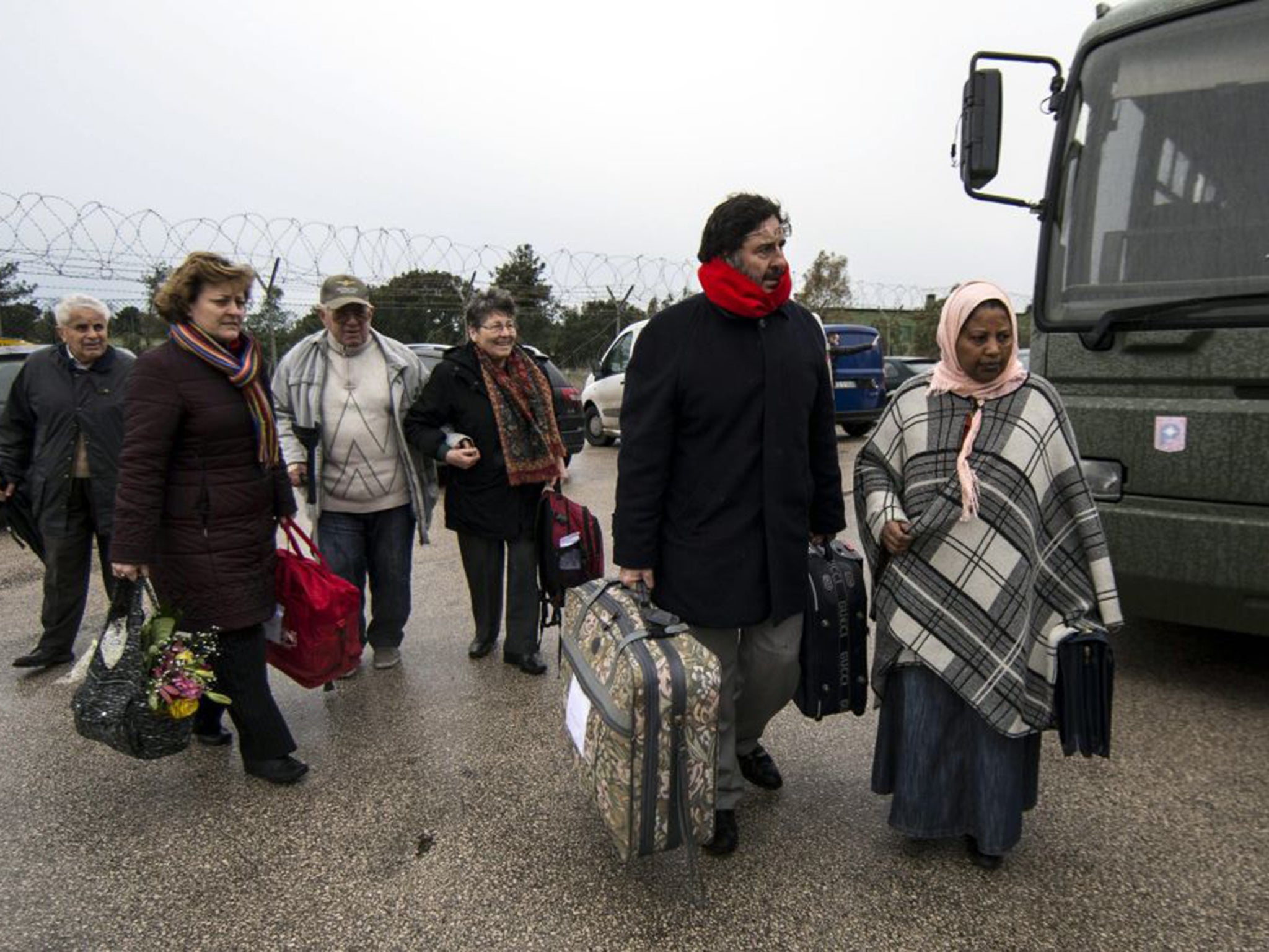 A group of around 60 Italians returned from Libya overnight after being evacuated because of security concerns about the advance of the ISIS